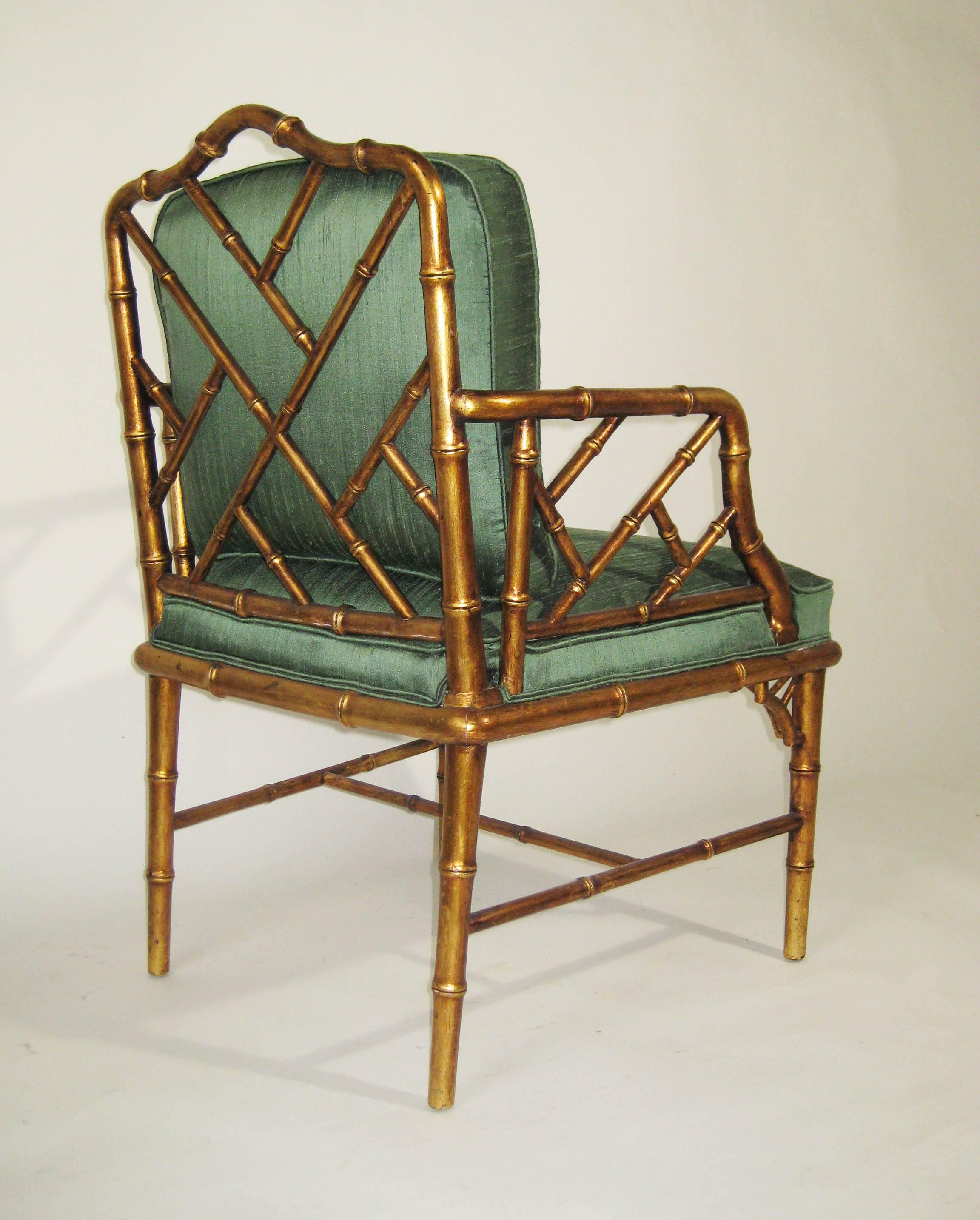 Pair of faux bamboo armchairs enriched in gold leaf and upholstered in "green tea" silk shangtu. From the 1960s and the fashion of that period for exotic, far-eastern influences. Obtained from an estate populated with pieces by Arturo