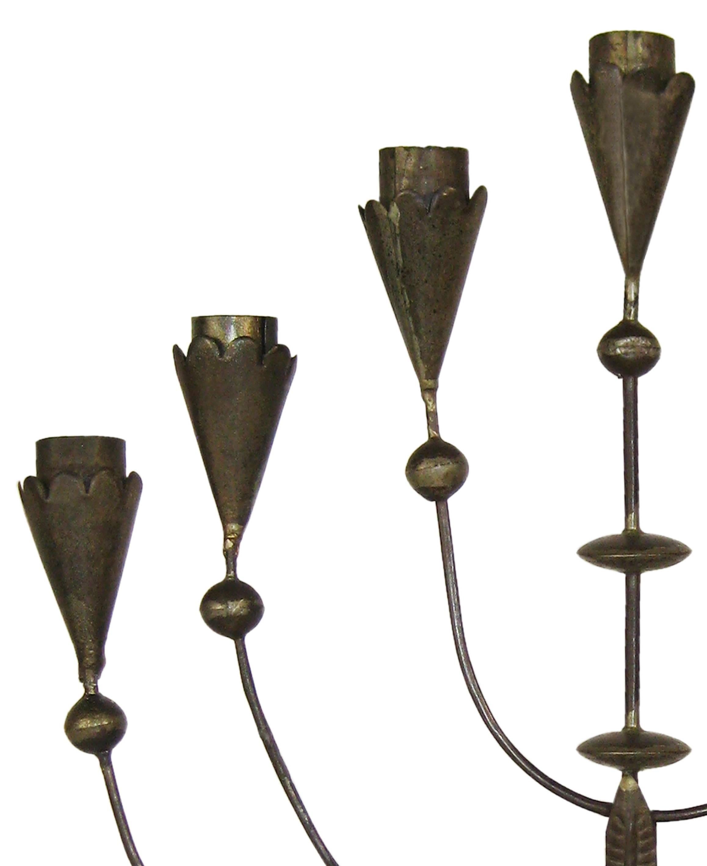 Candelabrum composed of seven arms with an octagonal base, found in various museum collections. A lovely piece dating back to Spratling's first design period, in the early Taxco years when he was still experimenting with a variety of