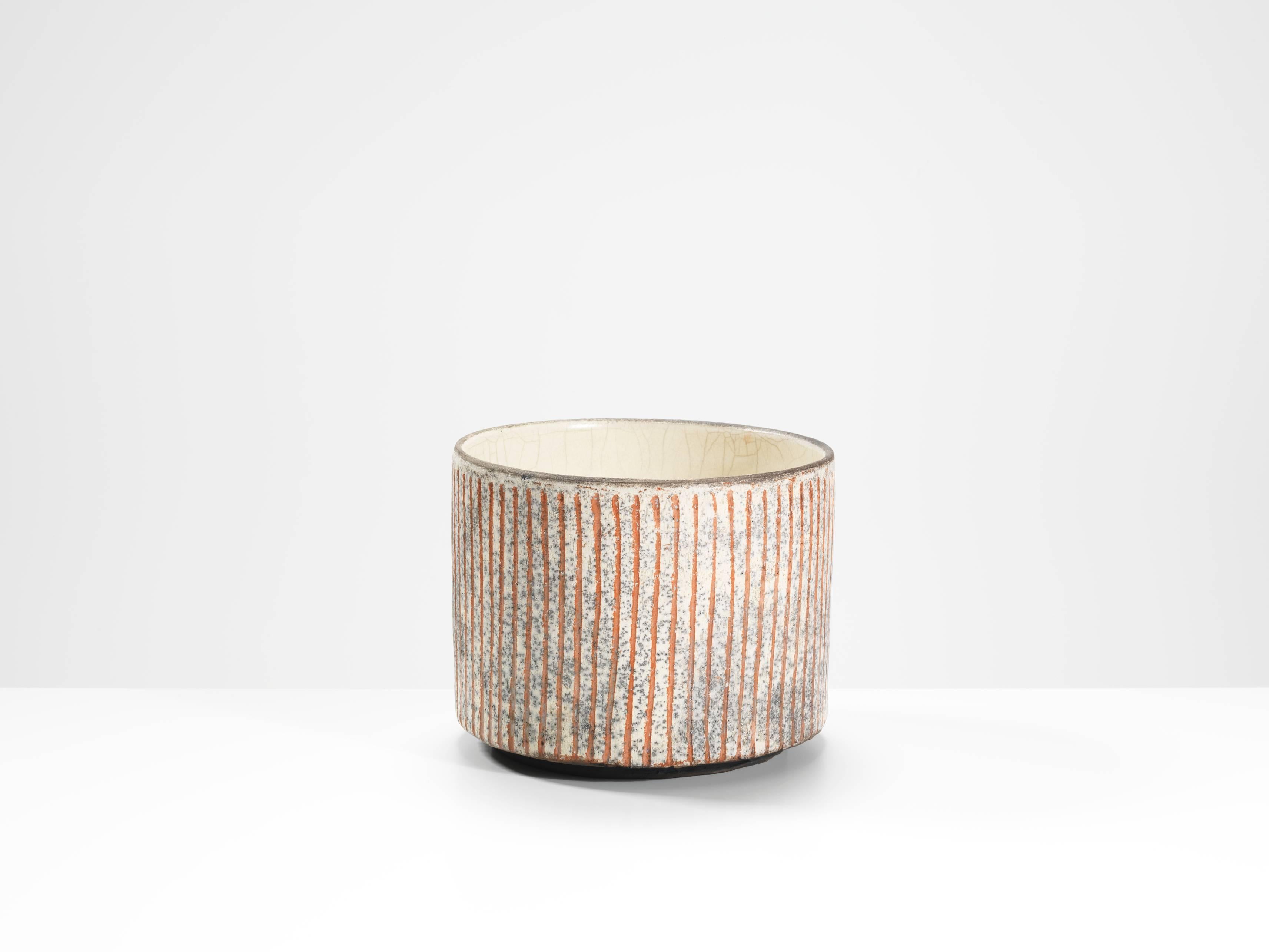 a striped bowl

raku fired

by Inger Rokkjaer

with potter's mark

14 x 18 cm (5 1/2