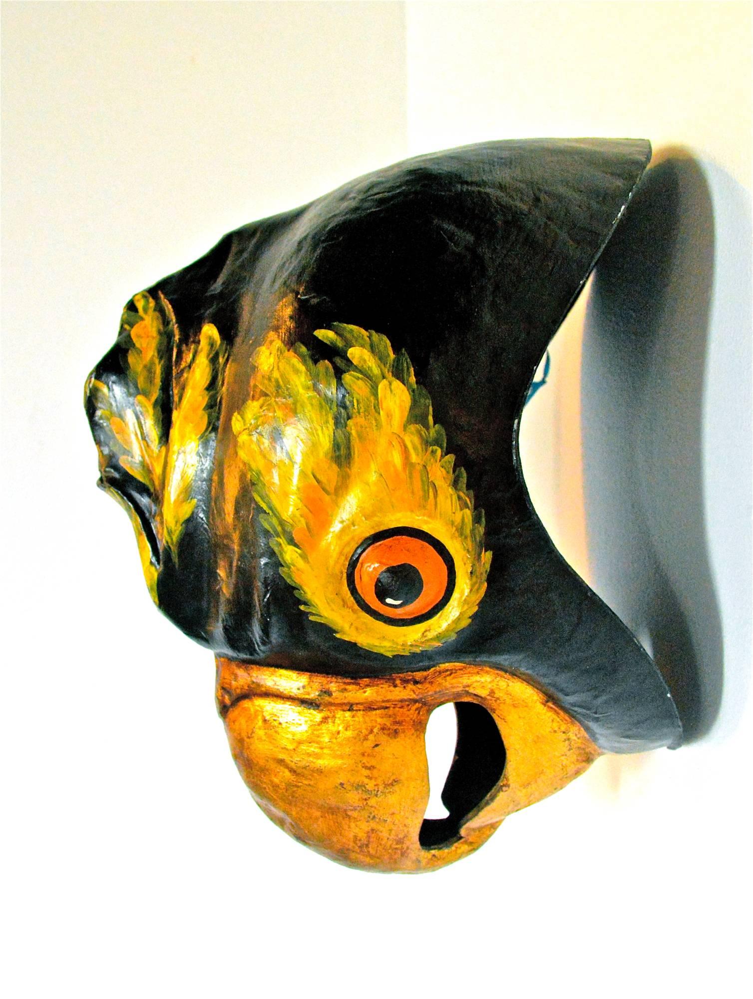 Hand-painted carnival mask of papier mâché' depicting a black hooded conure. The lovebird of South American origin can be sweet, or at times, quite feisty. This mask is wonderfully hand-painted and will surely be the hit of the party. 
Signed.
