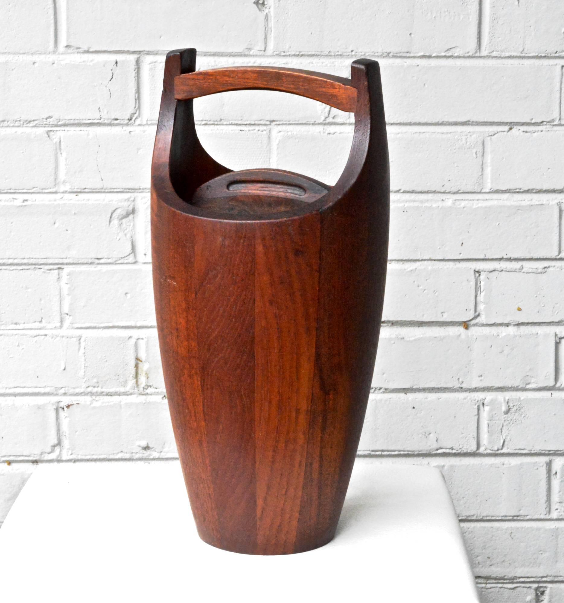 Teak Ice bucket designed by Jens Quistgaard for Dansk Corp, Denmark. The iconic and smartly constructed form is timeless and will last for years to come. This example is stamped "810" and based on deductive research comparisons is circa