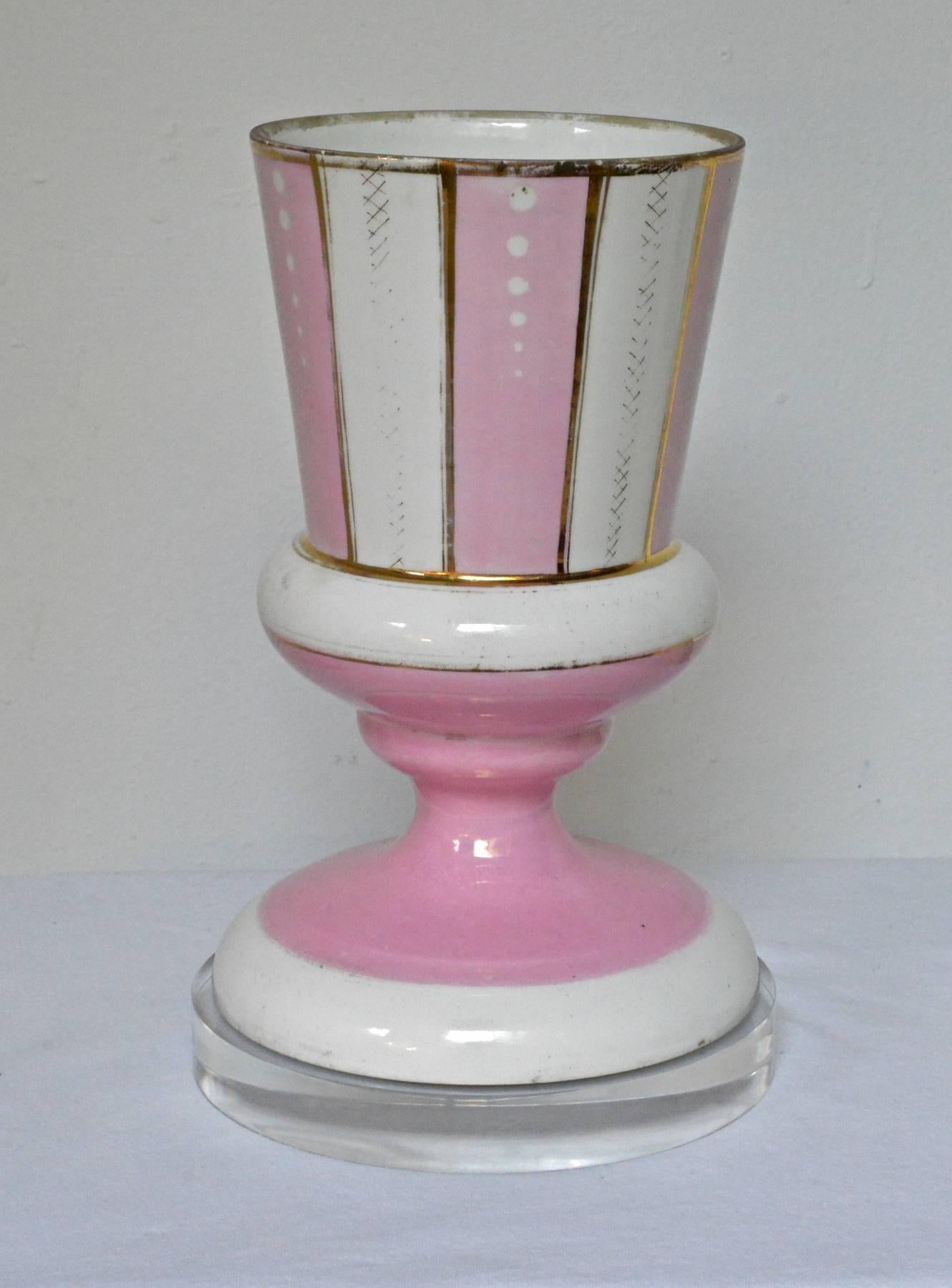 A pair of old Paris jardinières mounted on custom Lucite risers. The vibrant pink porcelain cache are late 19th century and were made by the German company C. Tielsch & Co. Stamped and signed underneath.