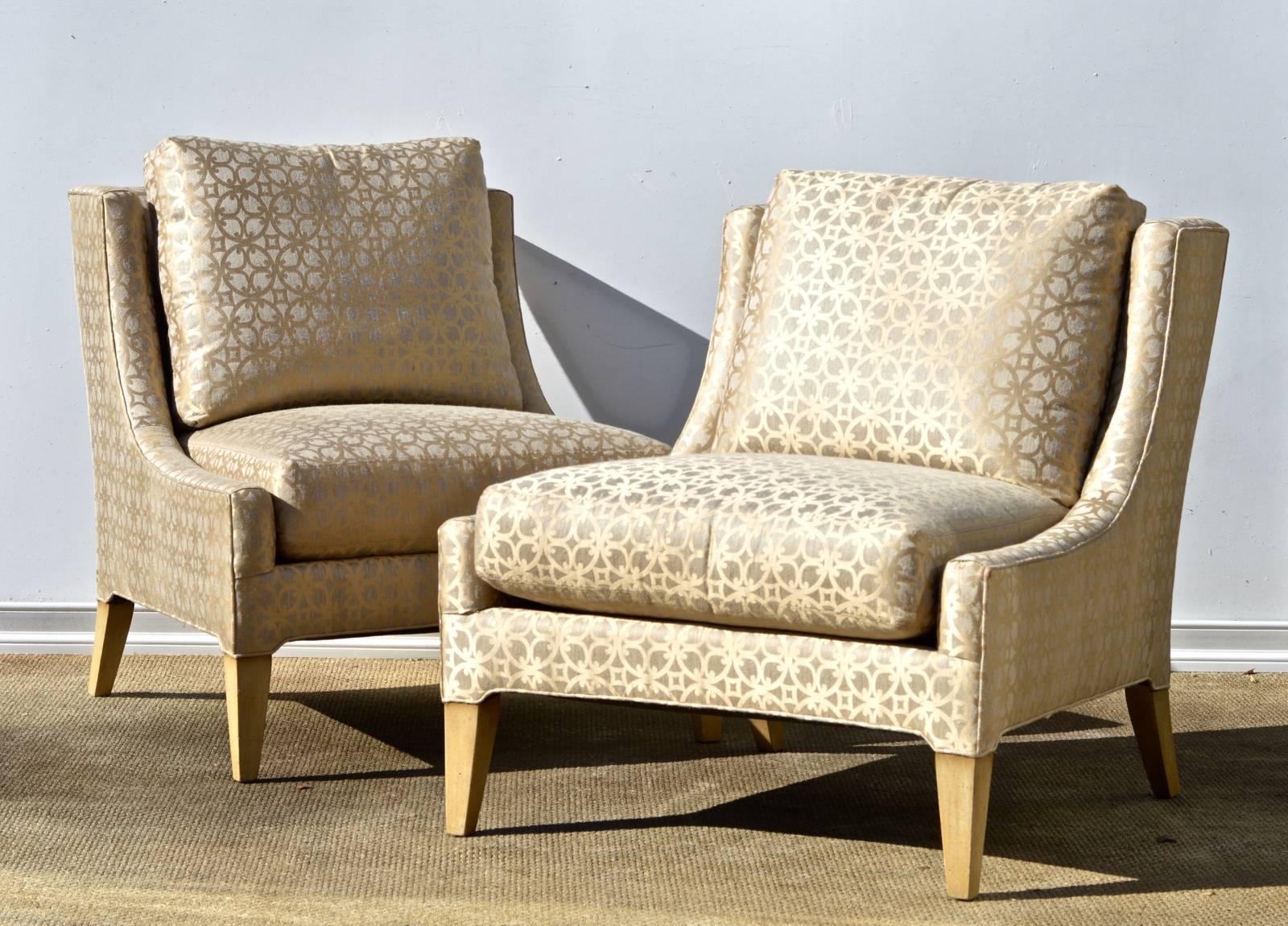 Stunning pair of oversized slipper chairs in a silk / linen blended quatre'foil fabric. Plush and overstuffed loose cushions on the seat and the back provide very cozy seating. Made by esteemed Ferguson Copeland Ltd.