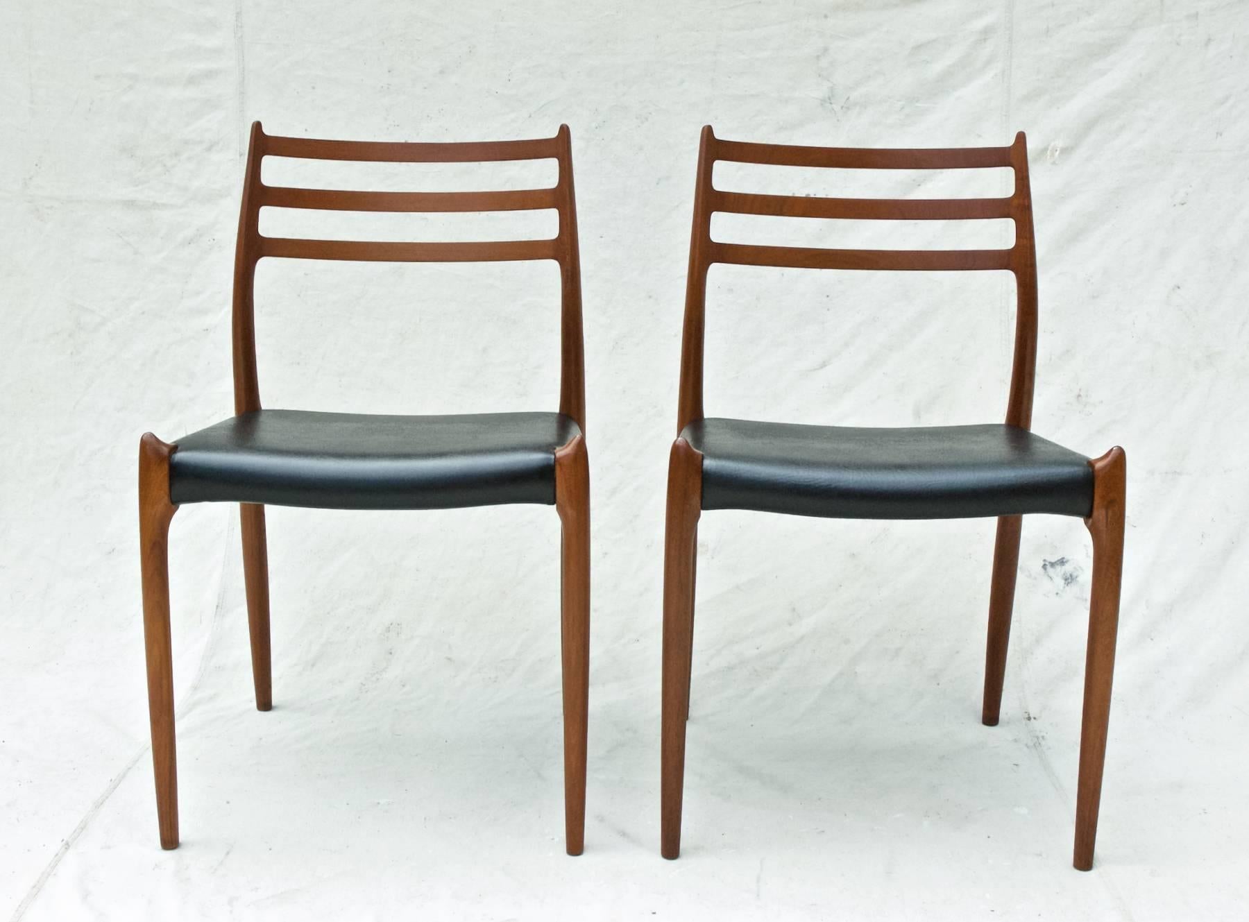 A fine pair of model 78 dining chairs by N.O. Moller. The gorgeous and sculptural Danish Modern chairs are in excellent structural condition throughout and possess a richness of woodgrain that set them apart from other teak wood models of this