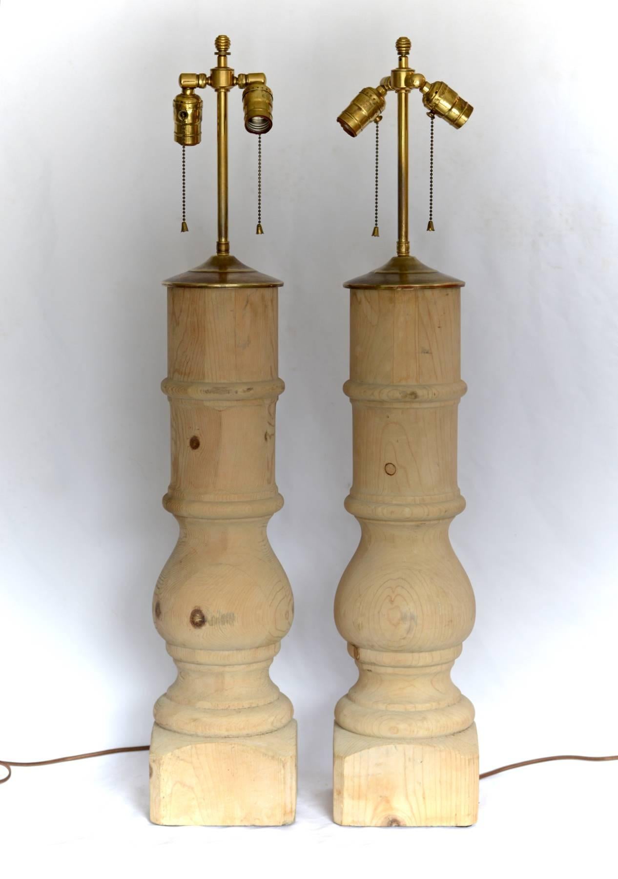 A good looking pair of Architectural lamps of bleached pine. Killer large-scale and the warmth of old, smooth wood make these tall table lamps proven winners in a wide range of interiors.