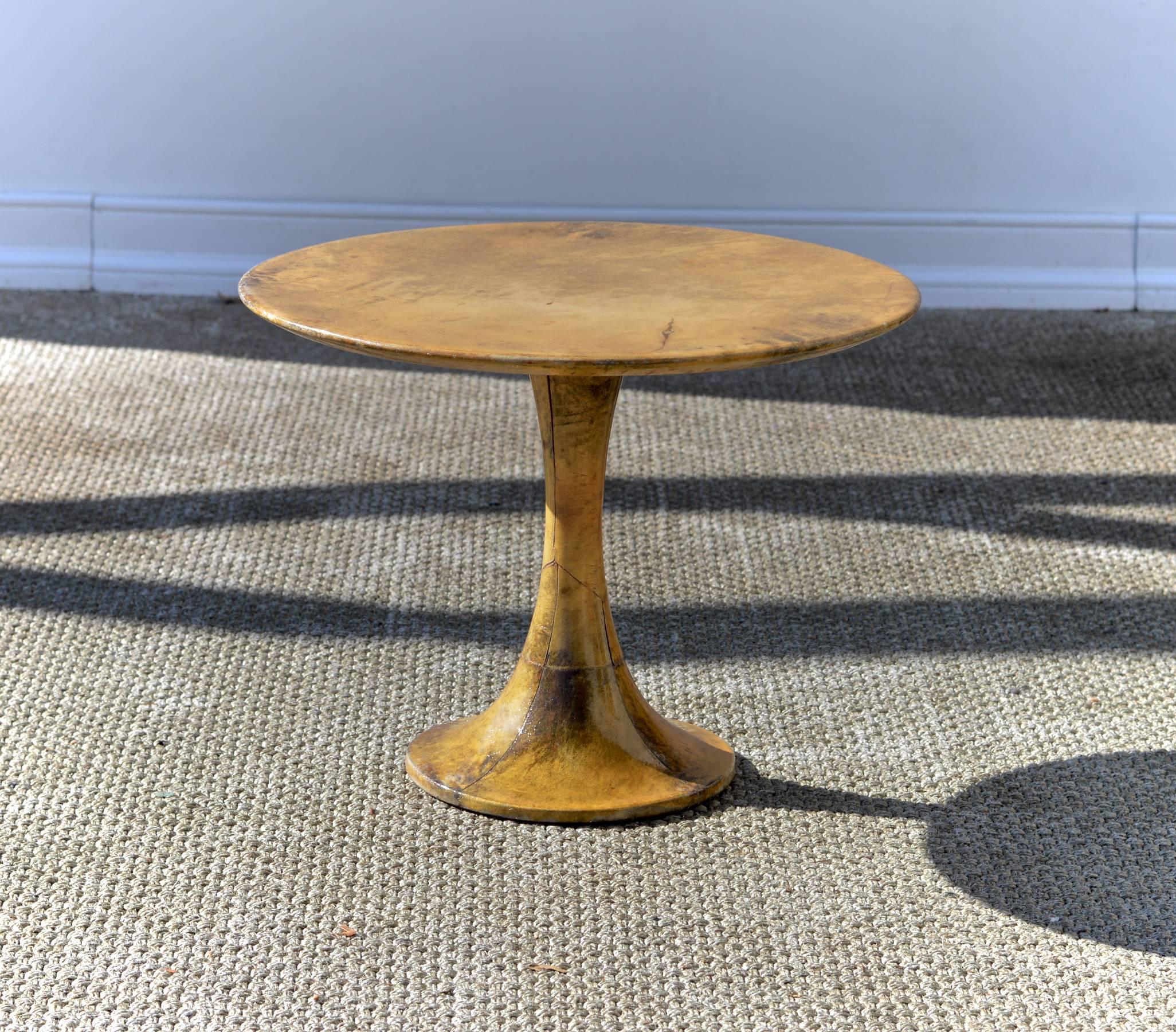 A petite tulip base cocktail table of dyed and lacquered goatskin in the manner of Aldo Tura.