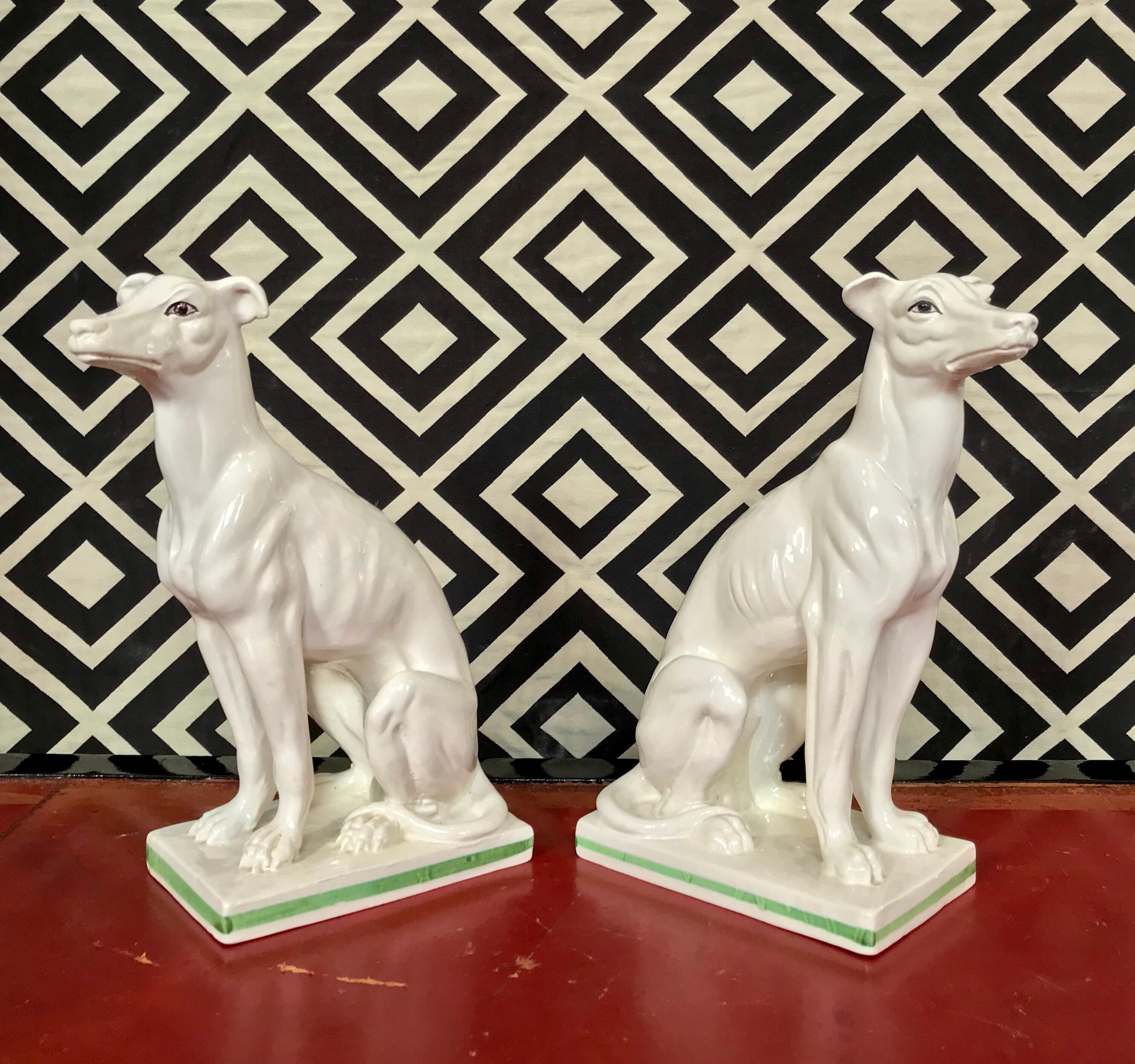 A pair of white glazed ceramic greyhound figures circa 1960 signed by the artisan and marked 