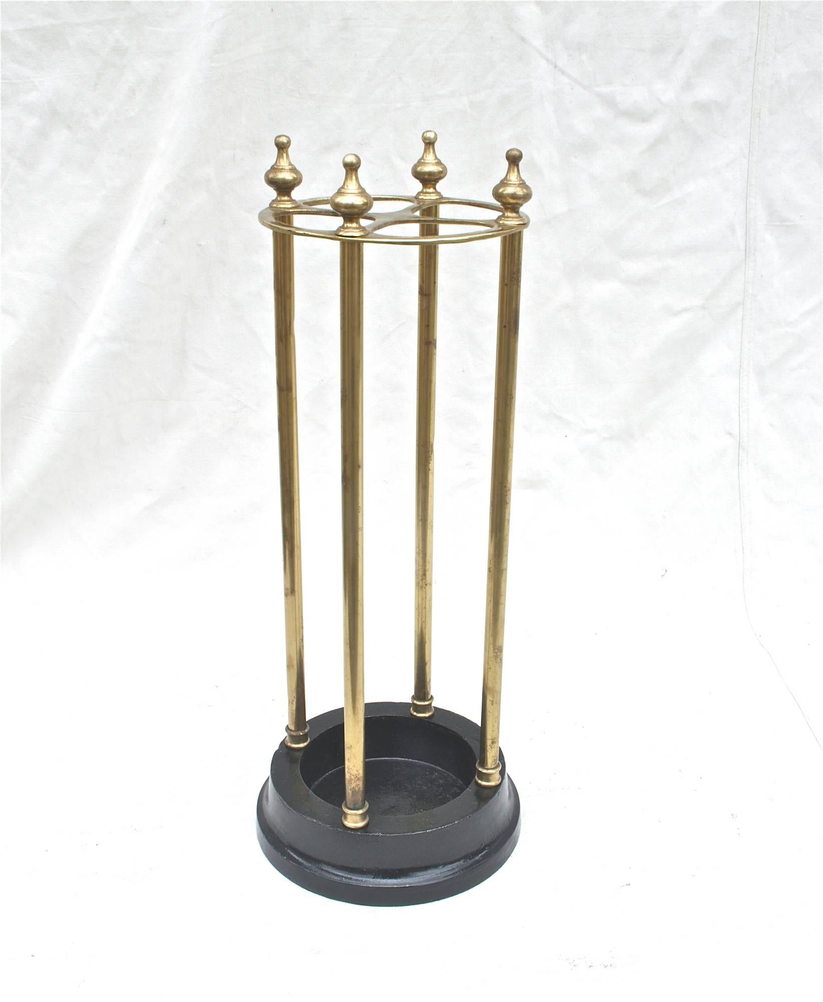A simple and elegant umbrella / cane stand. Brass and cast iron. Made in England. Fill it with your fine collection and it will serve you well for years to come.