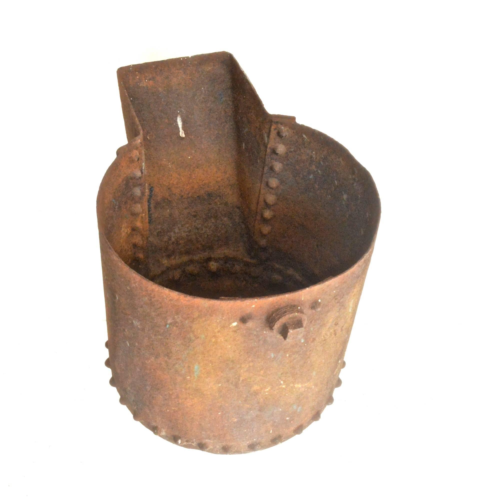 Industrial planter with interesting beaded detail. The factory caldron could very well have been a smelting or sludge pot for molten metals. It is perfectly weathered. Has to wear throughout, paint splashes etc. When used as a planter placed on a