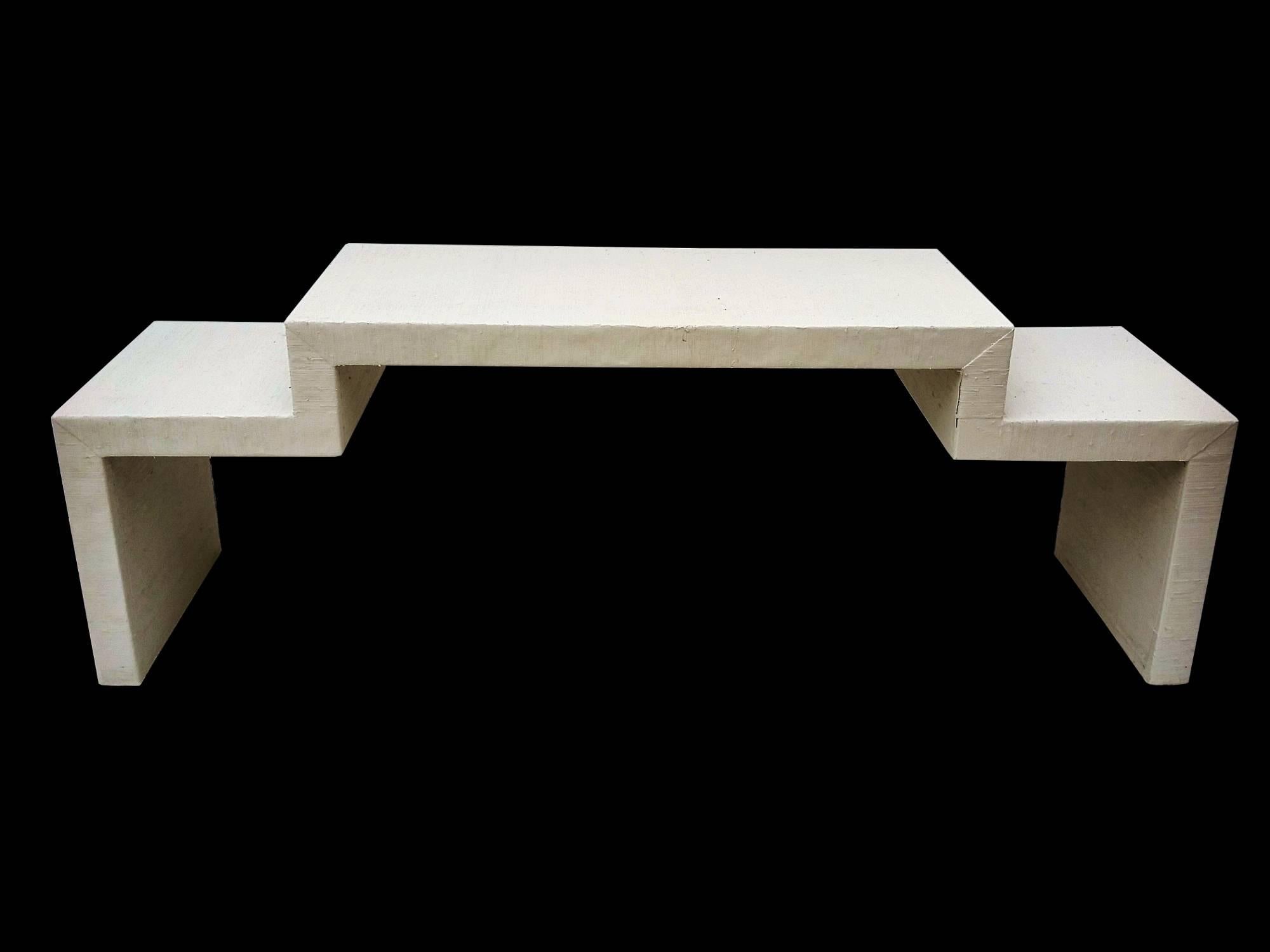 Stunning and unique coffee table having sleek modern lines and a painted grasscloth wrapped finish. The late 1970s table is constructed of heavy and very strong composite material that gives it a very sturdy feel. The table is quite heavy at around