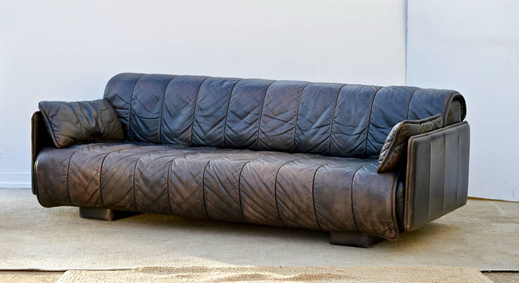 A good looking De Sede sofa in a beautifully patinated and gently worn dark brown leather. This late 1970s sofa was purchased new by my client and she has loved and cared for it. This model is a custom order of the convertible daybed as she wanted