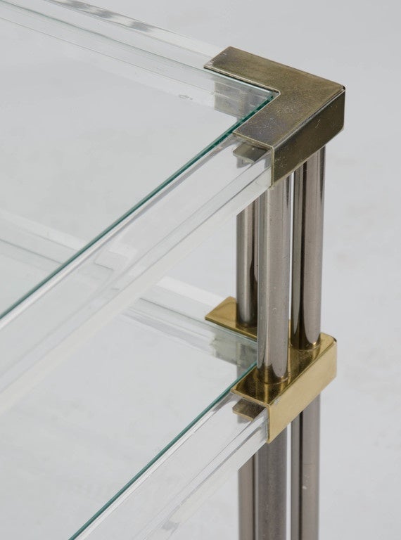 A pair of 1970s two tiers perspex and metal frame side tables.
