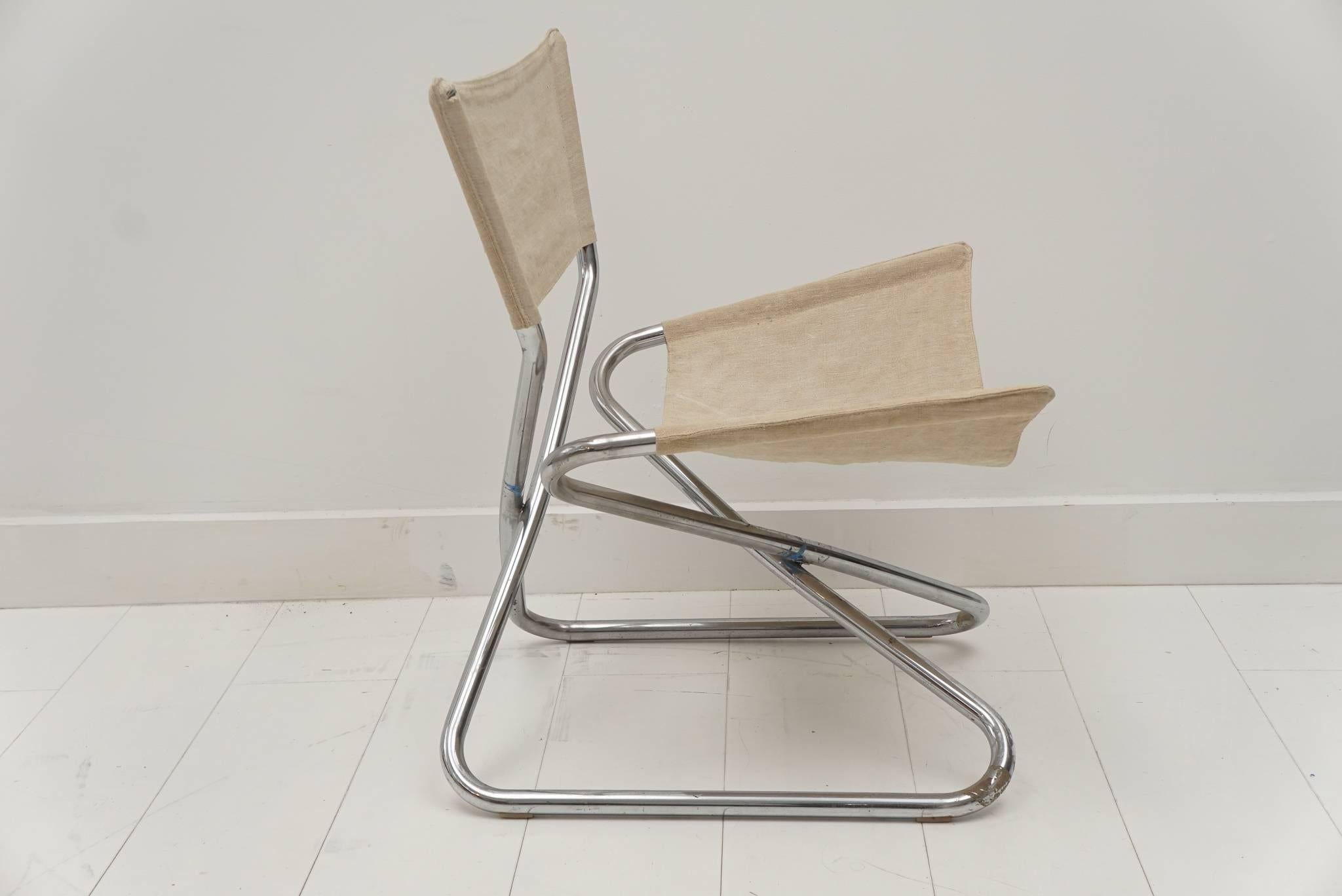 Polished chrome tubular folding chair with linen seat and backrest.