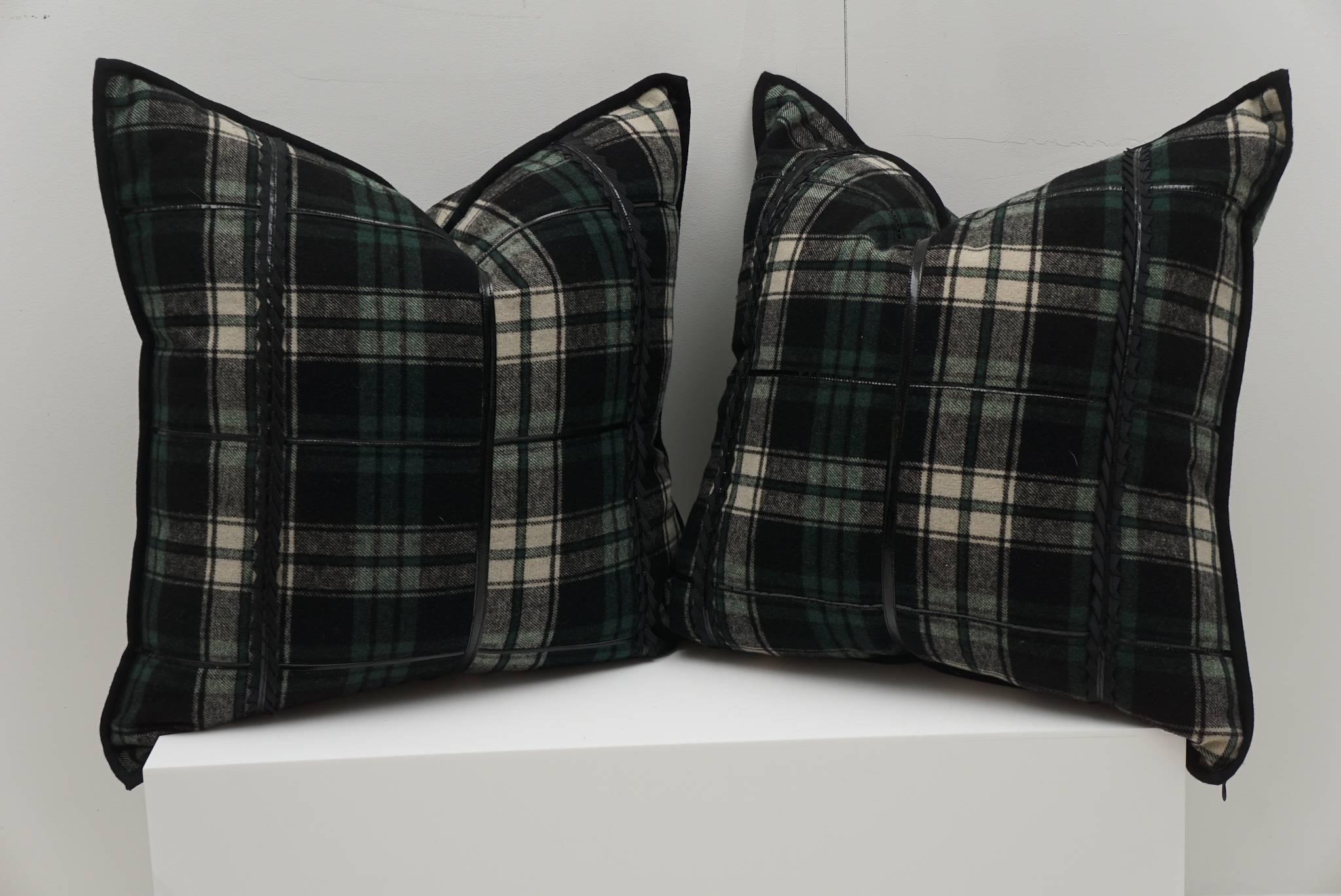 Tartan pattern wool pillows with applied patent leather bands. 50/50 down.