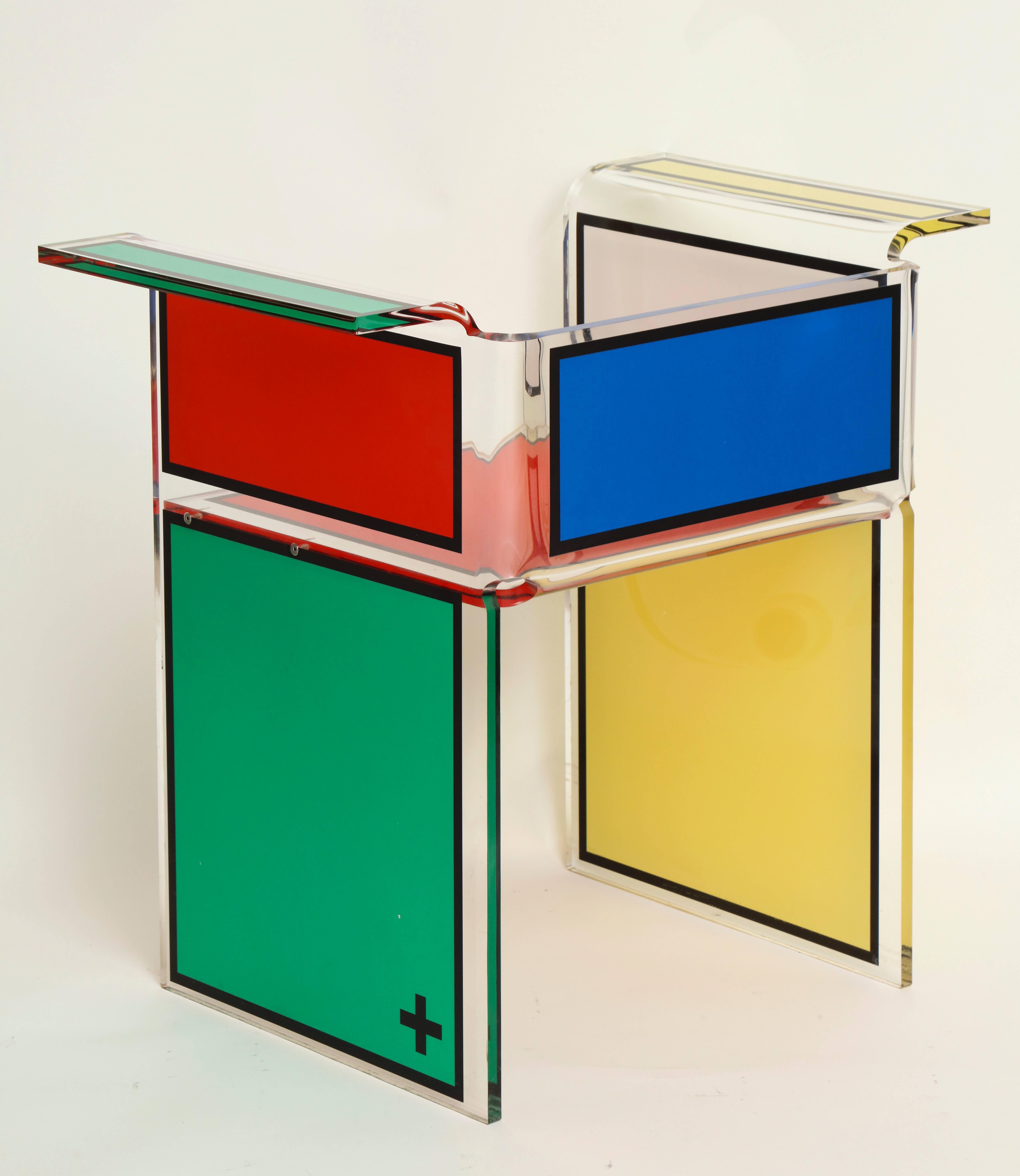 The chair is mono-block acrylic (i.e. no screws or adhesive bonding is used.)

Each side of a chair has a different color (four colors in total red, yellow, green, blue) imprinted on the back of the acrylic glass by Digital Laser Printing.