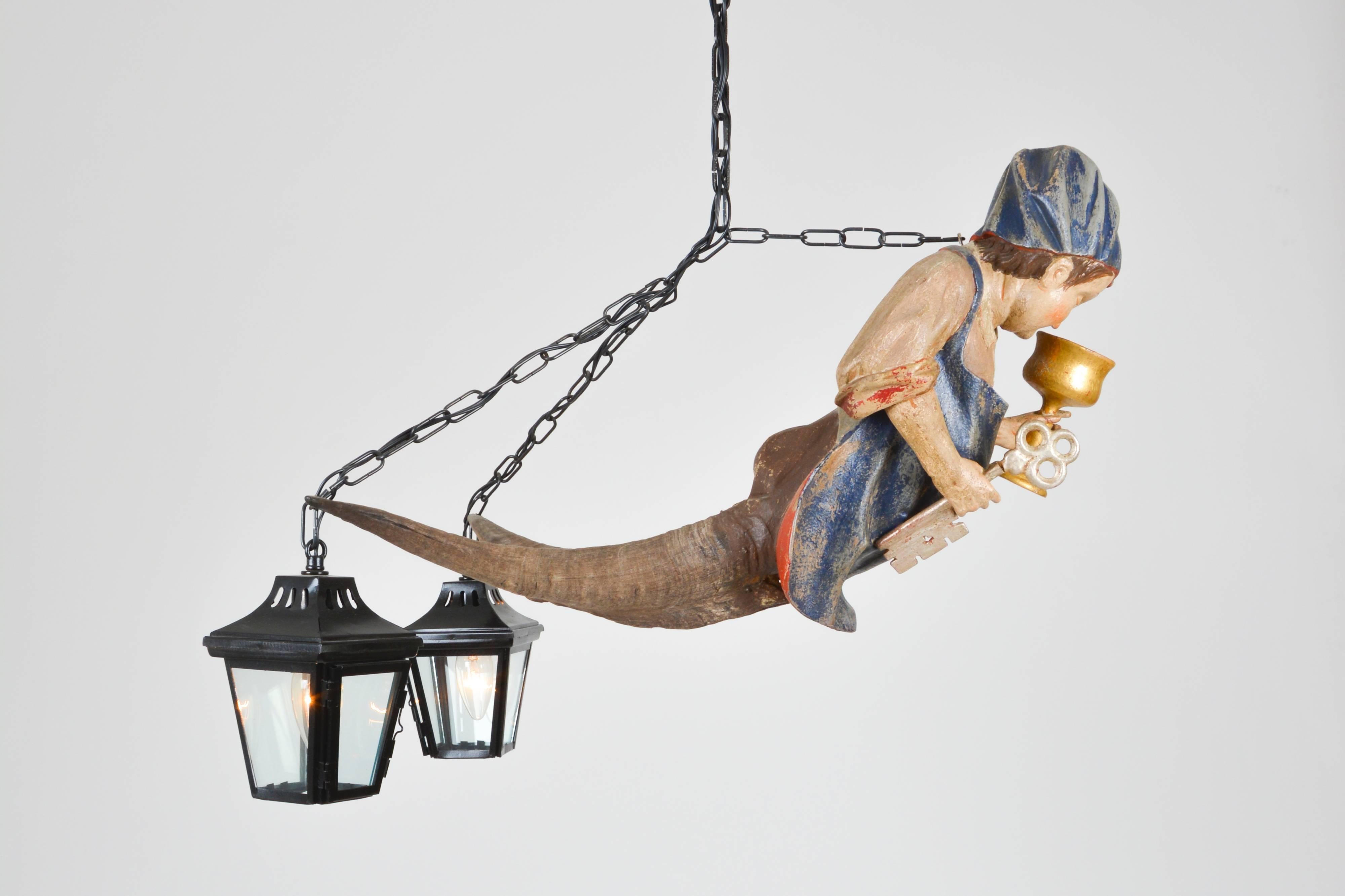 Rare male depiction of the typical rural figural chandelier called 