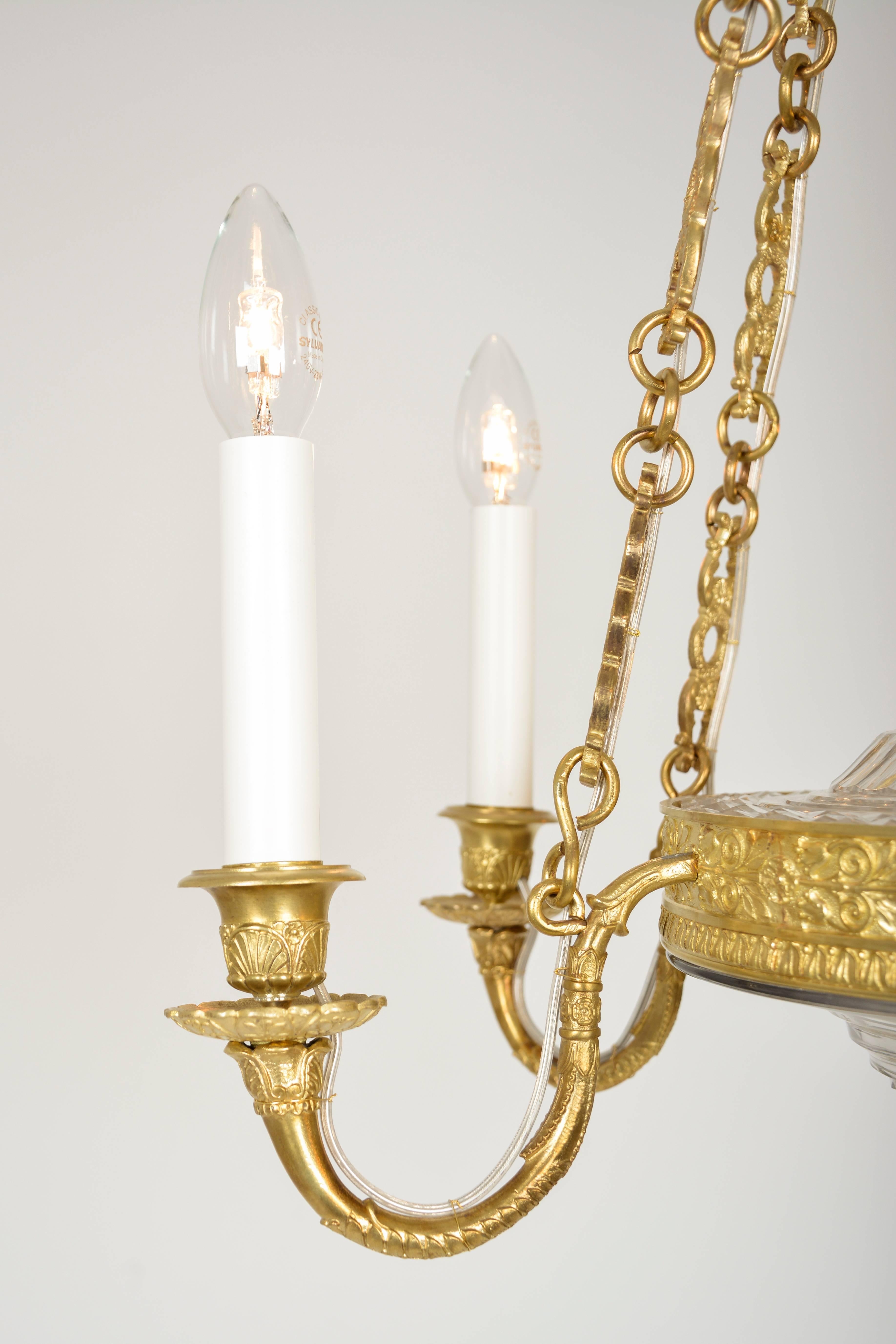 Empire Chandelier with cut glass and gilded cast brass frame In Excellent Condition For Sale In Vienna, AT
