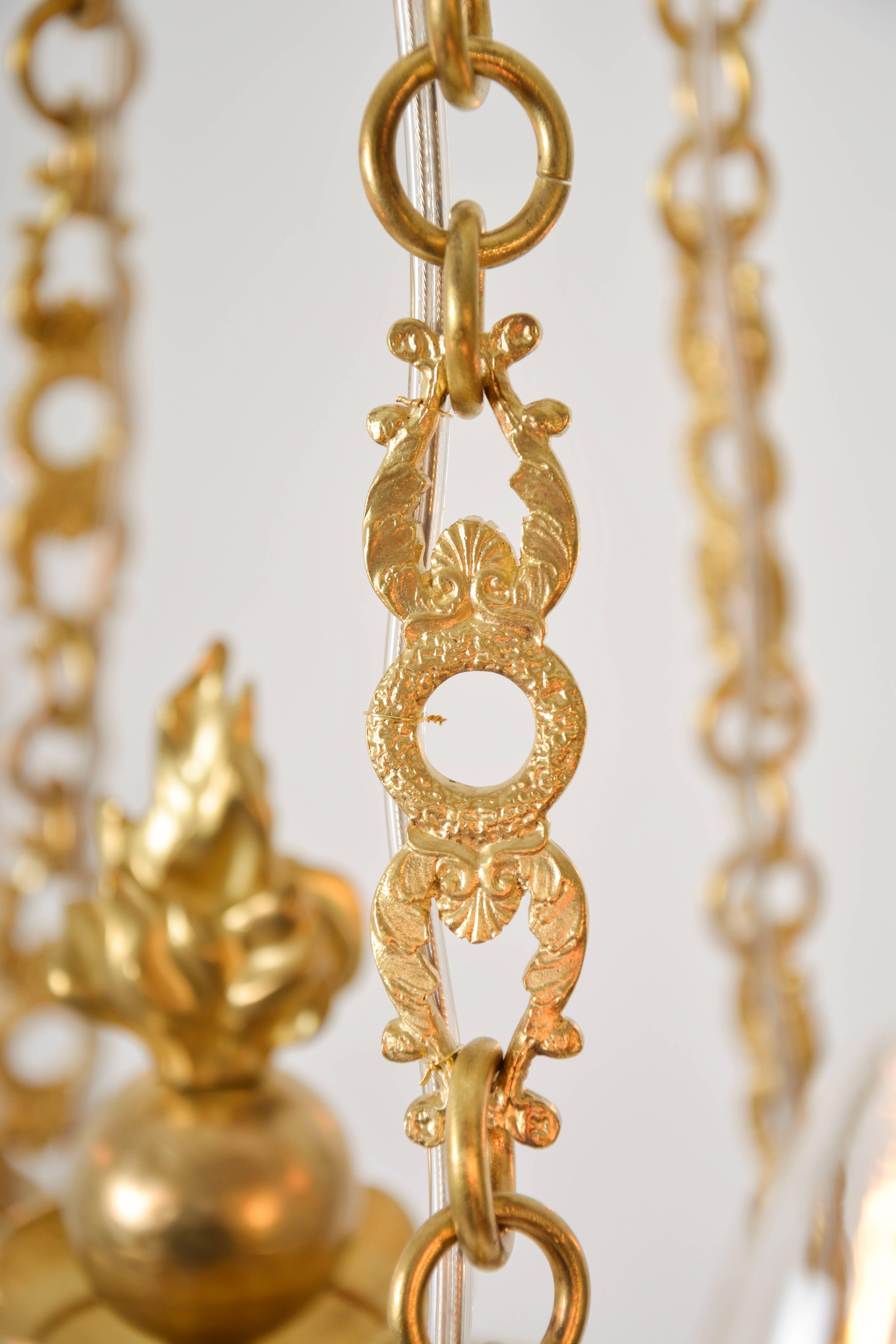 Austrian Empire Chandelier with cut glass and gilded cast brass frame For Sale
