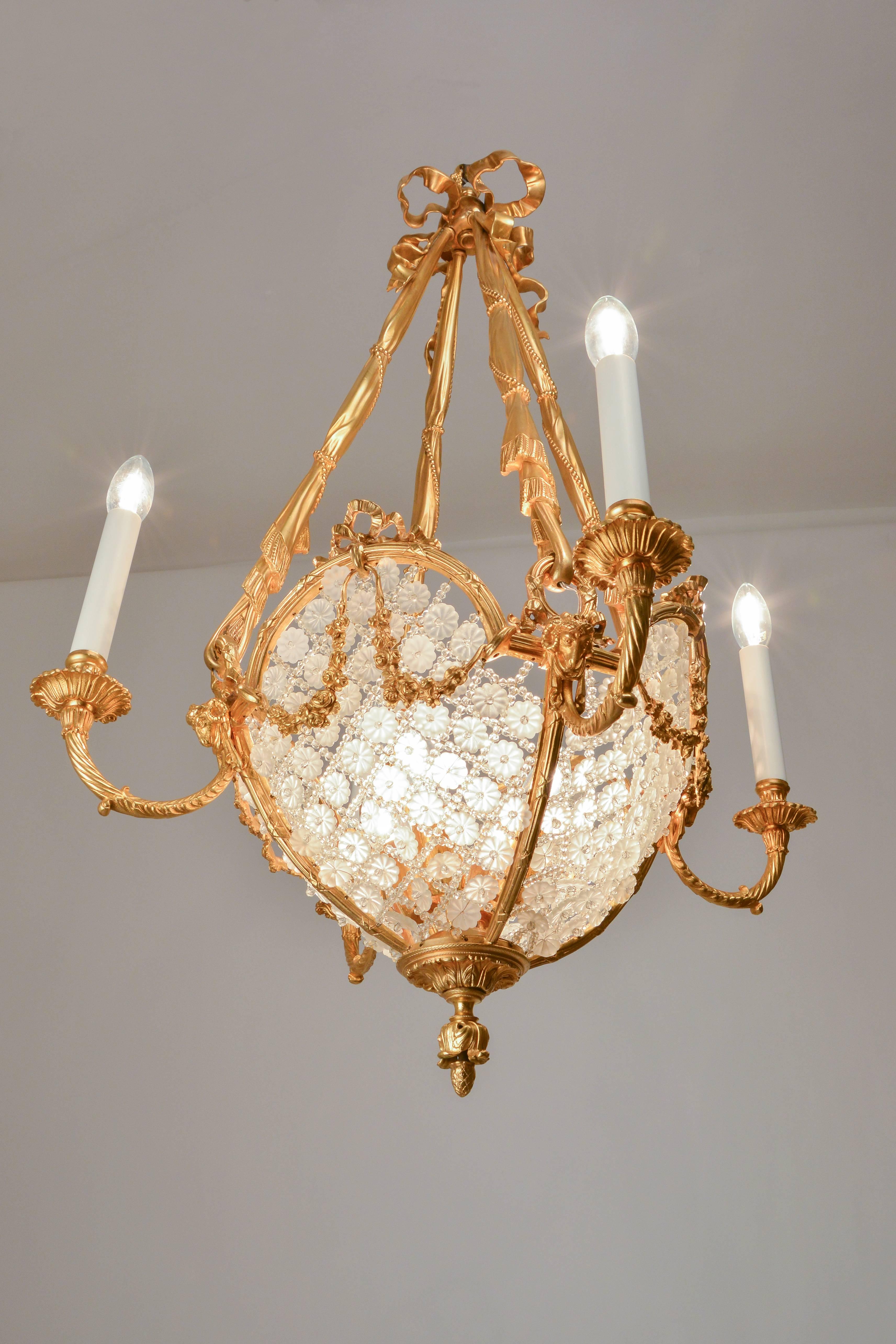 This is realistically cast pendant lamp is a masterpiece of French artisans. The expertly cast and refined suspension realistically depicts a draped scarf with pearl-string details. The body of the pendant spans a delicate mesh of tiny cut pearls