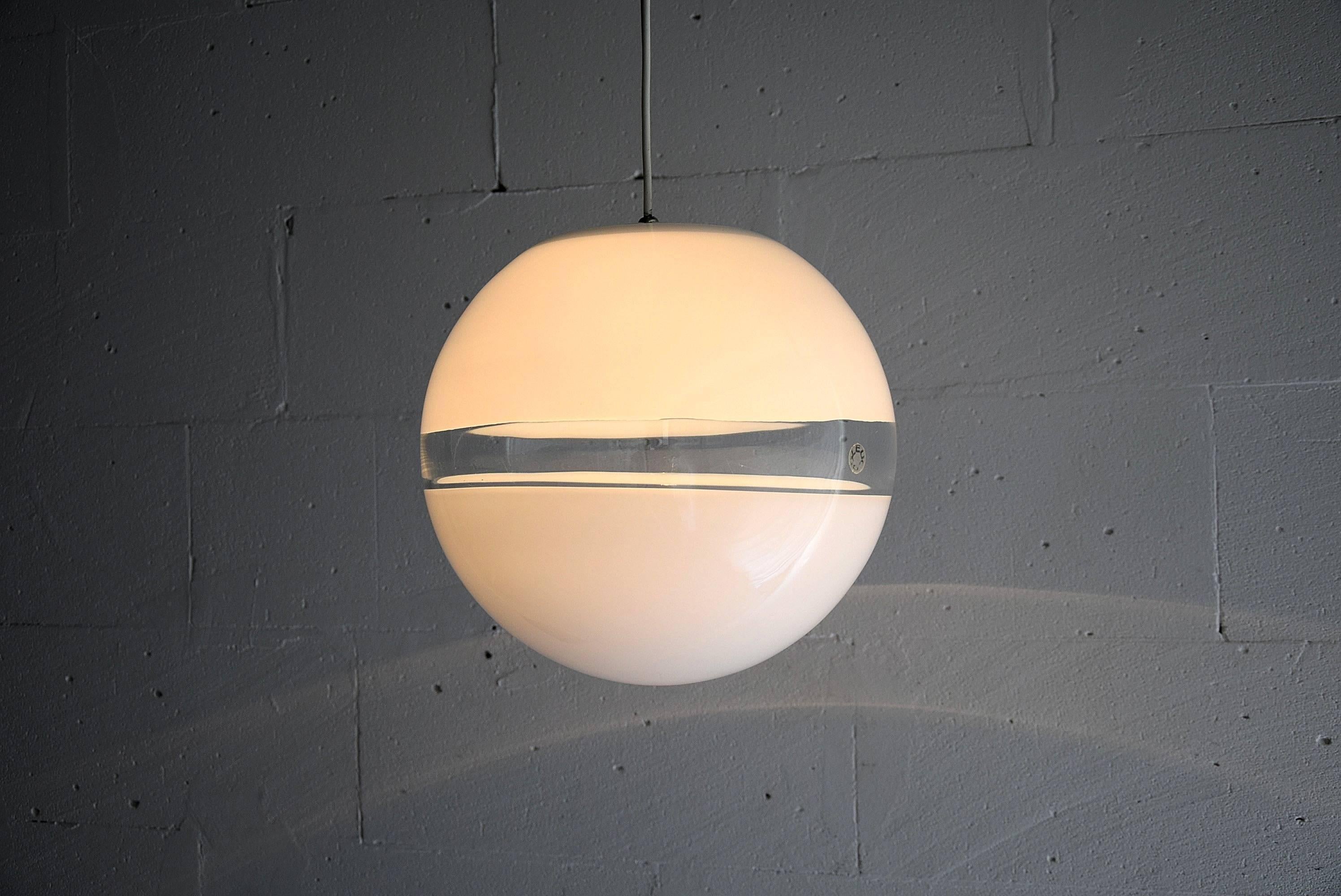 Leucos 1970s handblown in Murano, Venice, Italy. An intriguing white and transparent sphere of which the lower half seems to float in space.

The lamp is in fantastic condition.

Lamp will be shipped abroad in a custom made wooden crate. Cost of