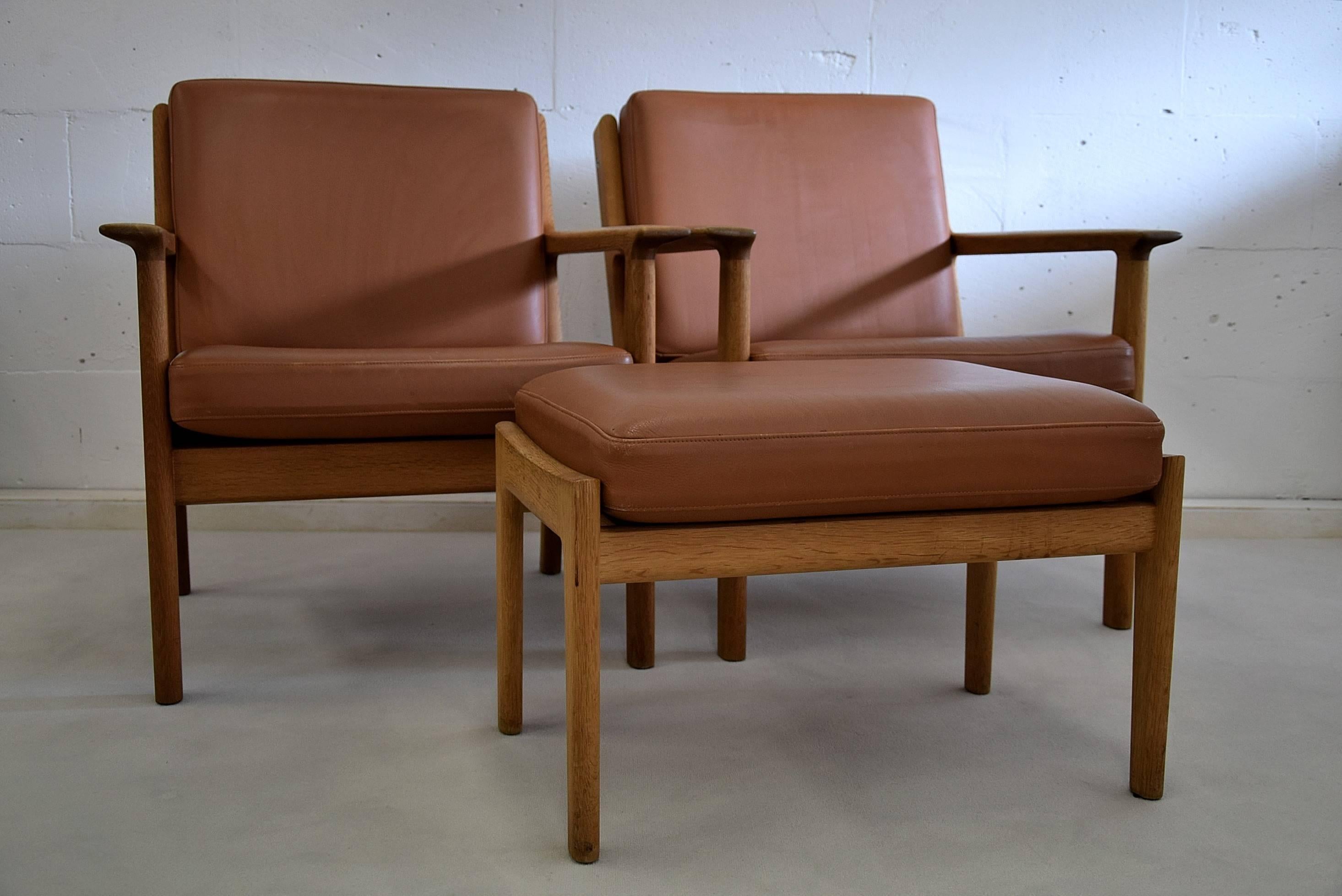 Hans Wegner Mid-Century Modern hocker and lounge chairs
Sophisticated stylish pair of GE265 lounge chairs and footstool designed by Hans Wegner in the late 1950s for GETAMA, Denmark.

Both the chairs and the hocker come with their original leather