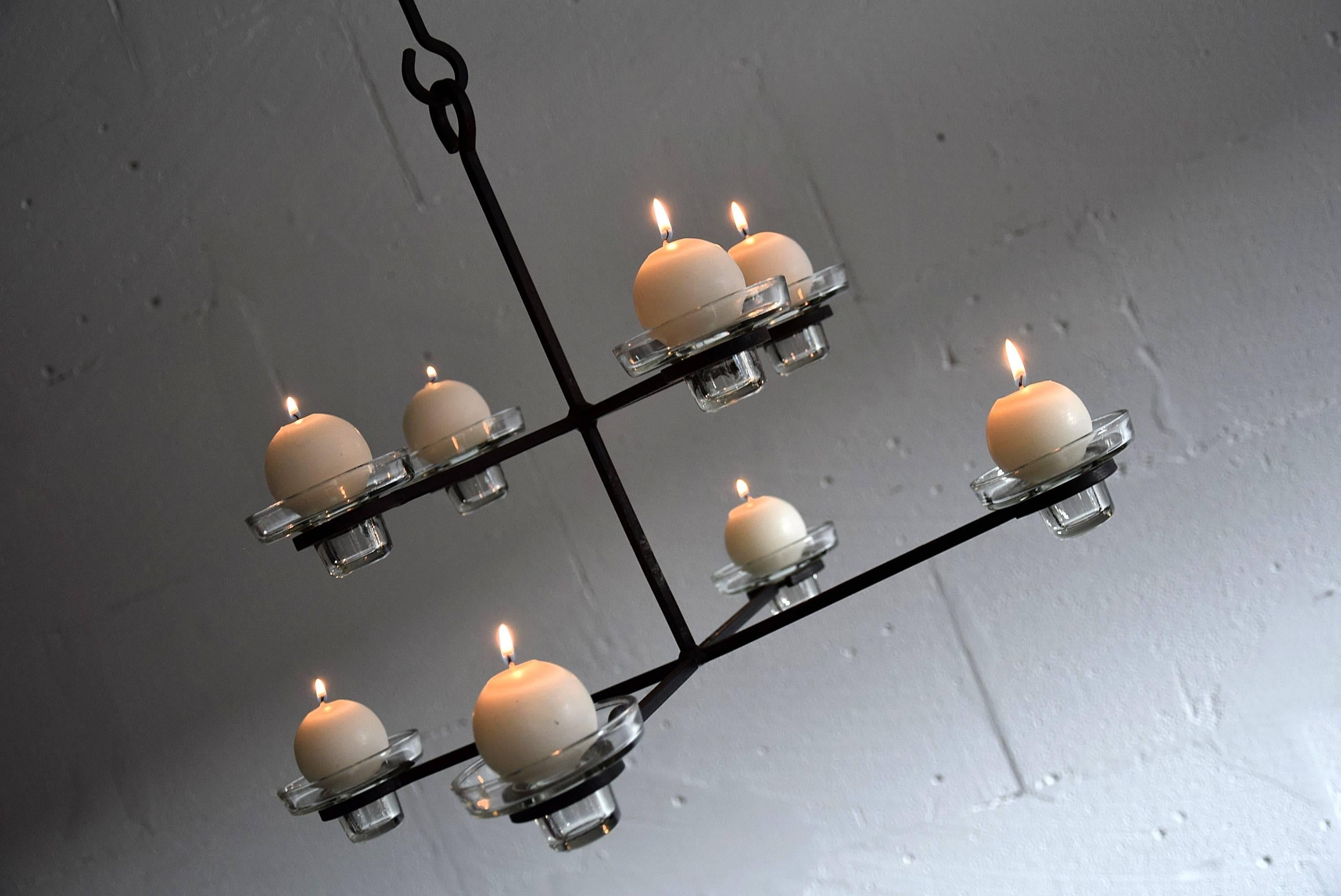 Erik Hoglund Mid-Century Modern Scandinavian chandelier
Chandelier holds eight glass candleholders. 

Measurements : D.60 x H.133 adjustable. Height without the chain 34cm.

Erik Höglund is a legendary Swedish artist famous for his unique carving in