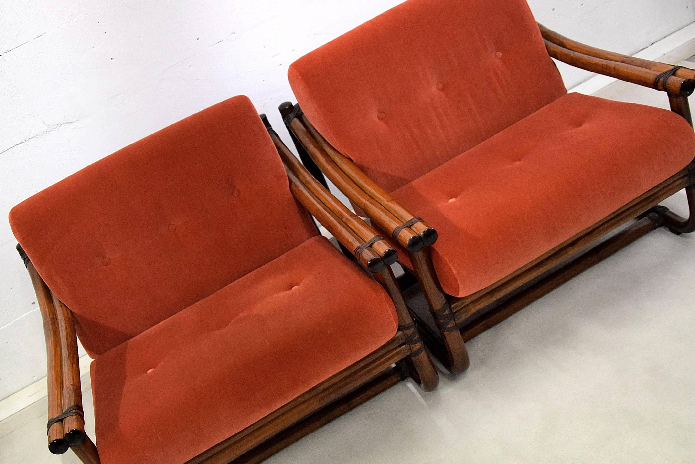 Beautiful Bamboo Italian made mid century modern lounge set
Gorgeous and classy Italian made set of two chairs and one hocker in fantastic condition. The bamboo has a wonderful patina and with the brick orange veluto upholstery it is truly beautiful