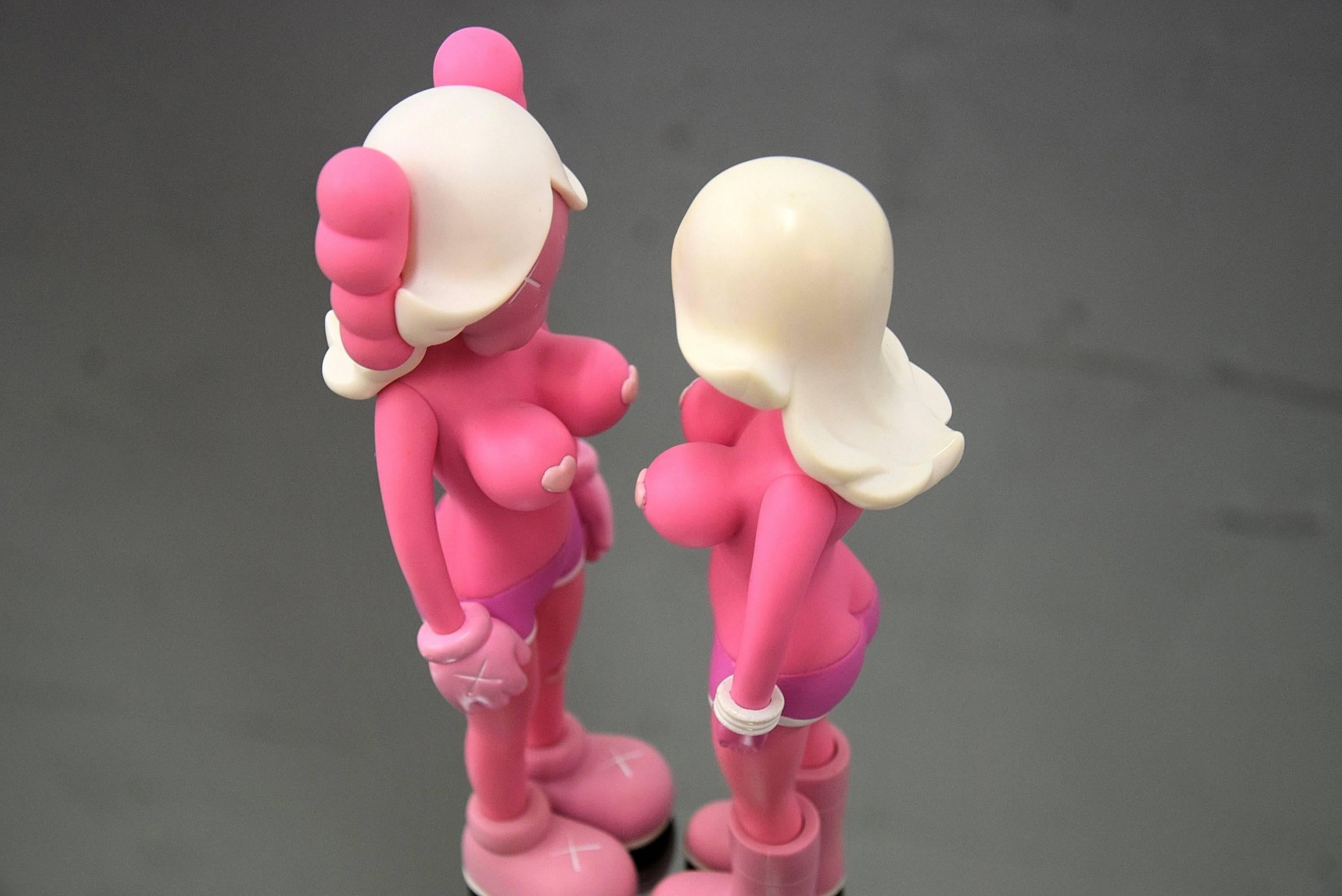 A collaboration between brooklyn-based artist, KAWS and graffiti artist, Todd James (REAS), this set of figures feature the unique styling's of each artist in a neutral, tonal palette. 

Twins have never been exposed and have always been stored