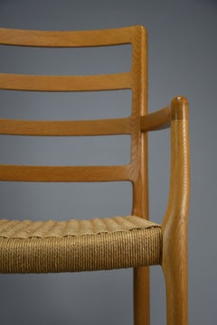 Poltrona Niels Otto Møller Modello 68 in rovere e cordoncino di carta, J.L. Møllers Møbelfabrik, 1