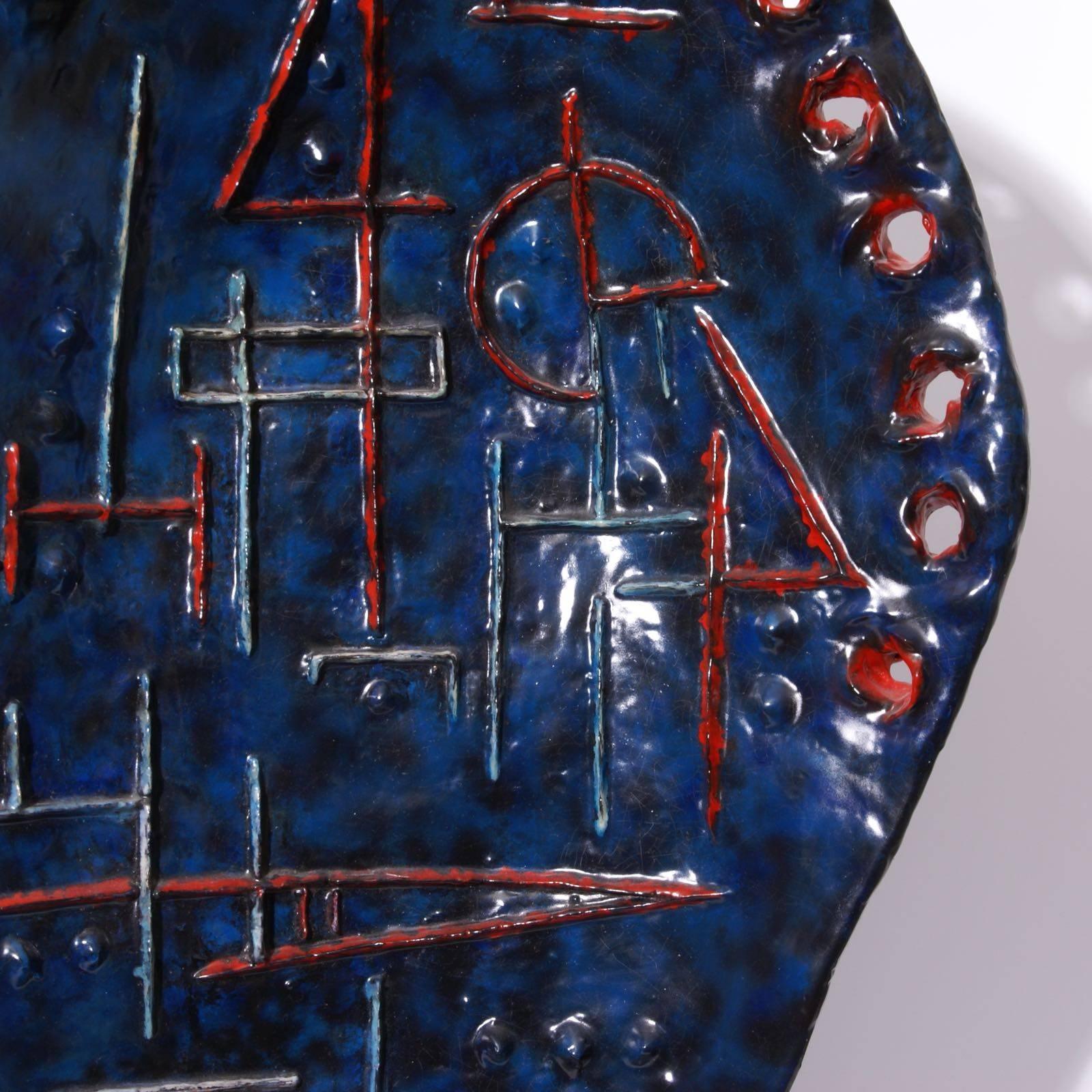 Outstanding blue and red glazed earthenware asymetrical 