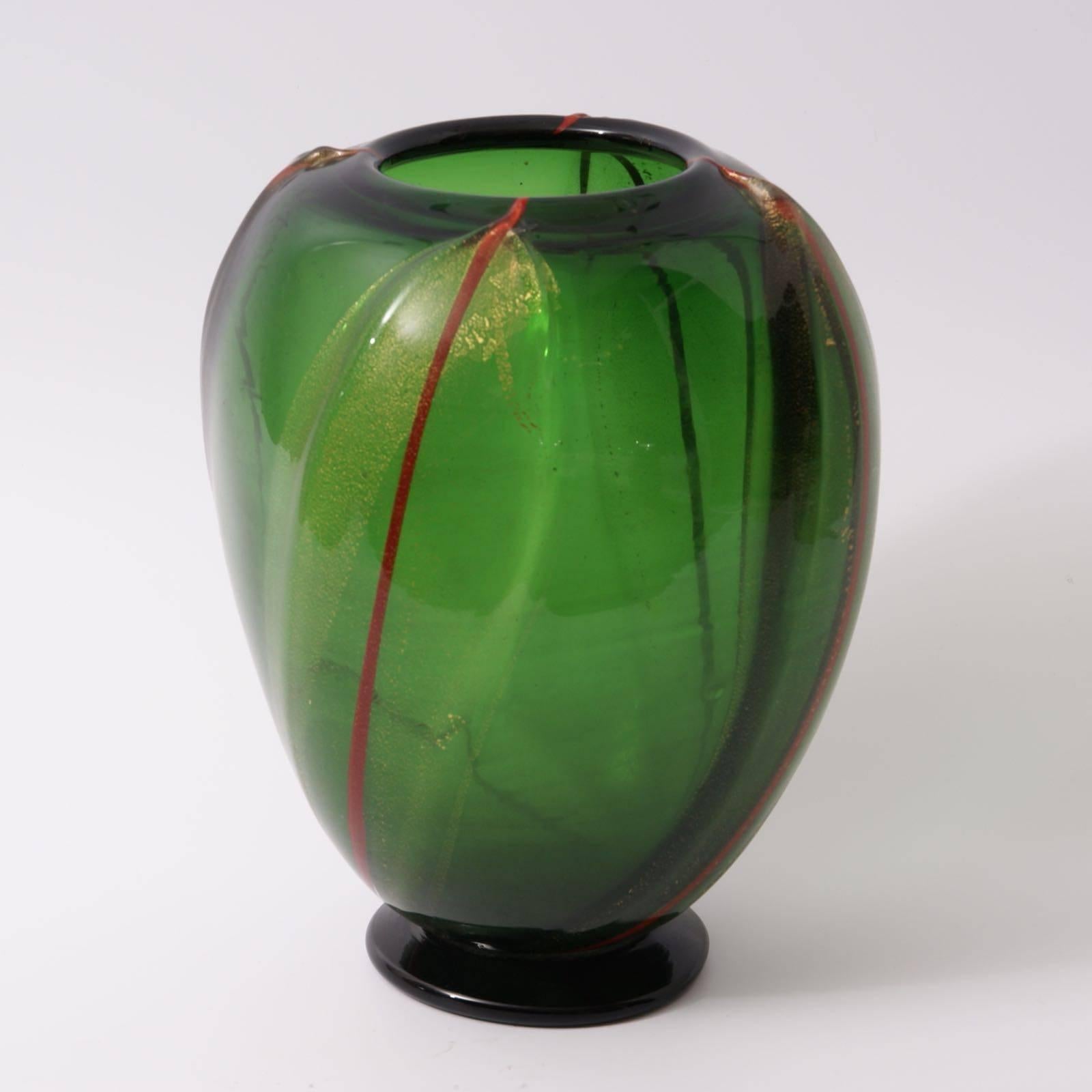 The green glass with gold inclusions and four red stripes footed vase, designed by Vittorio Donà for S.A.I.A.R. Ferro-Toso, circa 1933.