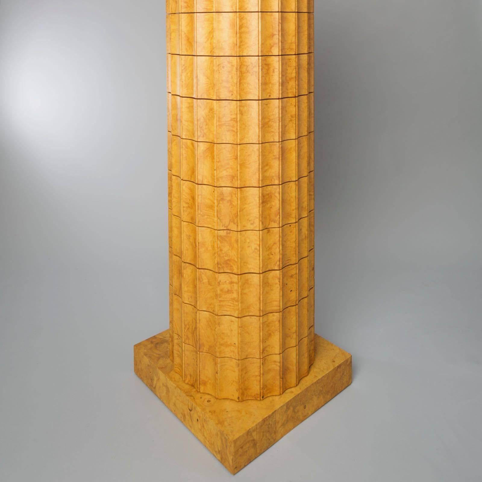 Fantastic and rare column with 11 compartments, ash tree, glass bottom for each compartment. This column was designed by the Swiss designers Trix & Robert Haussmann for the Röthlisberger collection in 1982. The compartments may be open separately,