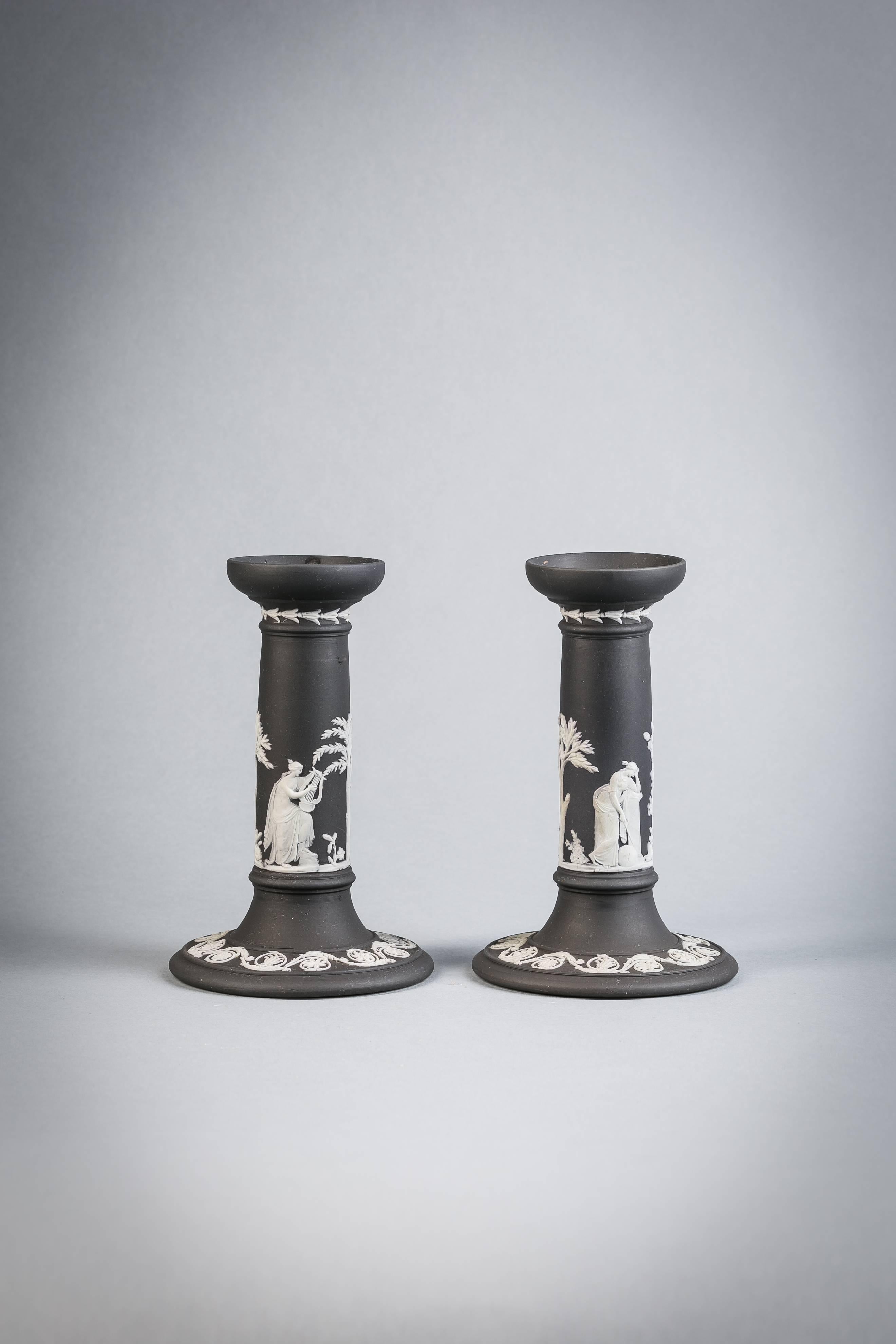 Pair of black and white Wedgwood Basalt candlesticks, 19th century.