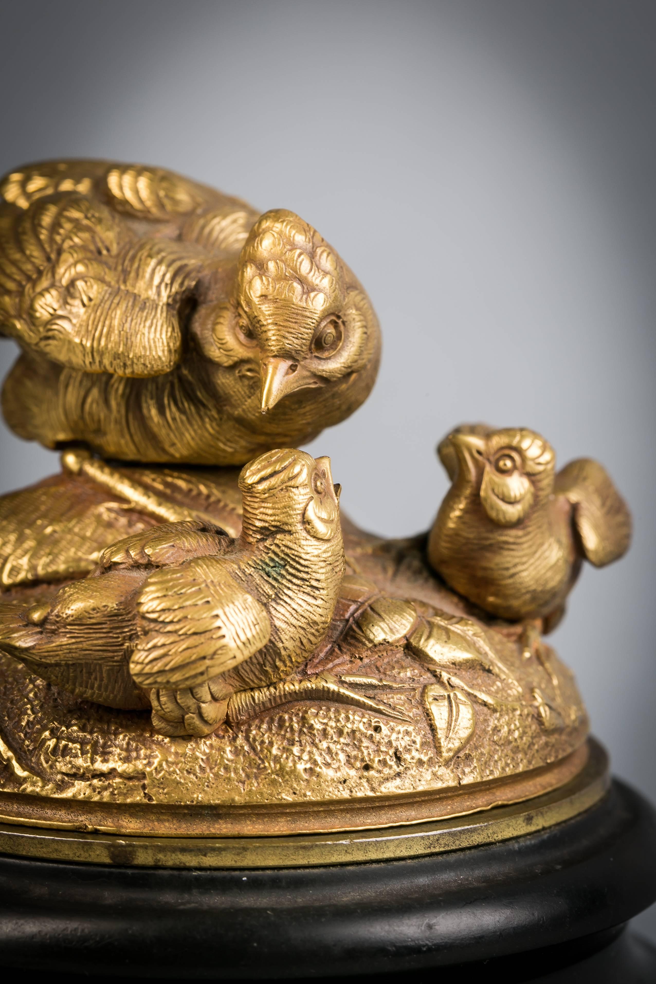 Gilt bronze sculptural inkwell, signed Leblanc, circa 1875.

Depicting a family of birds on a black slate stand.