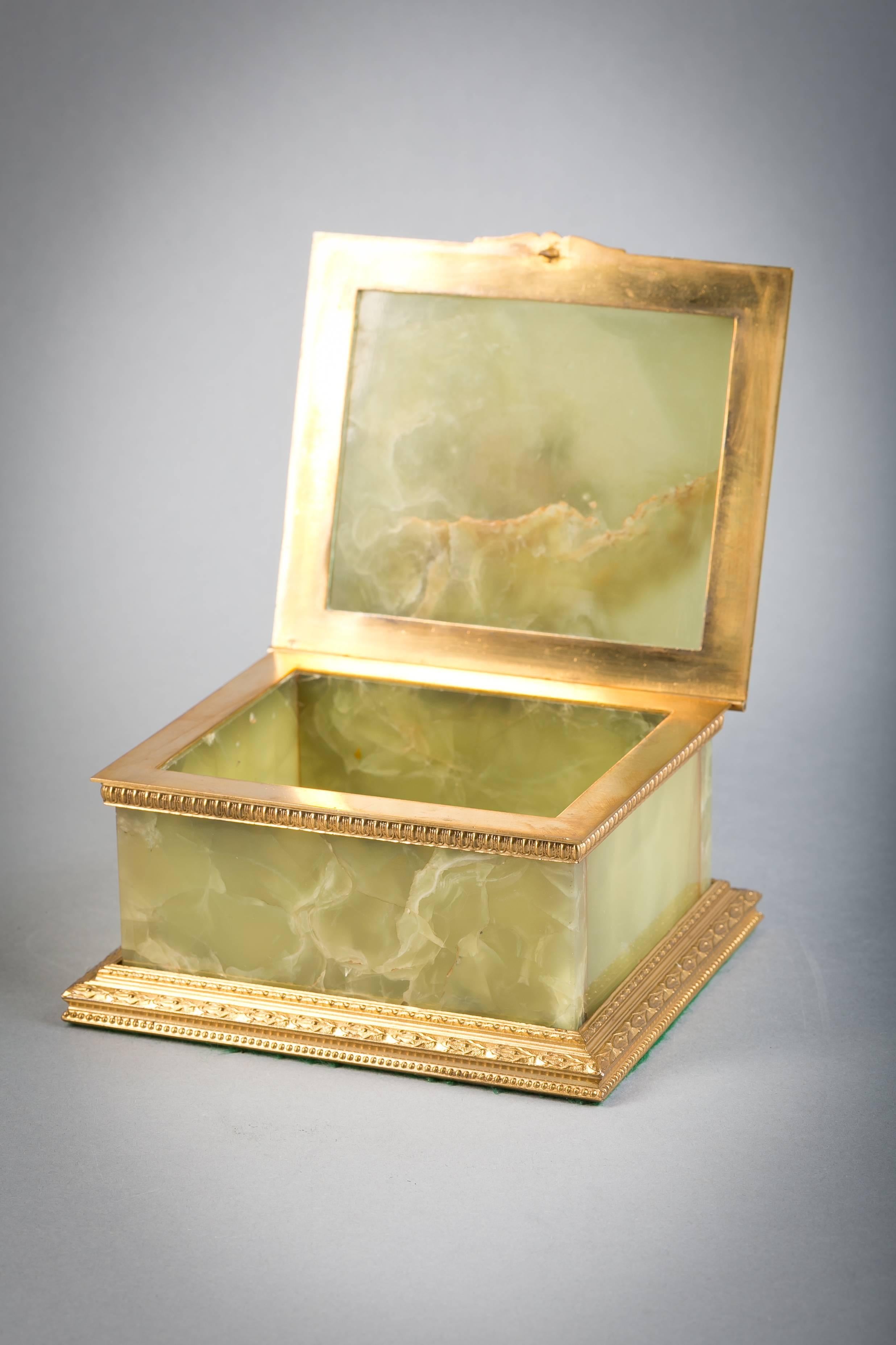 Bronze-mounted onyx box with agate elephant, circa 1900.