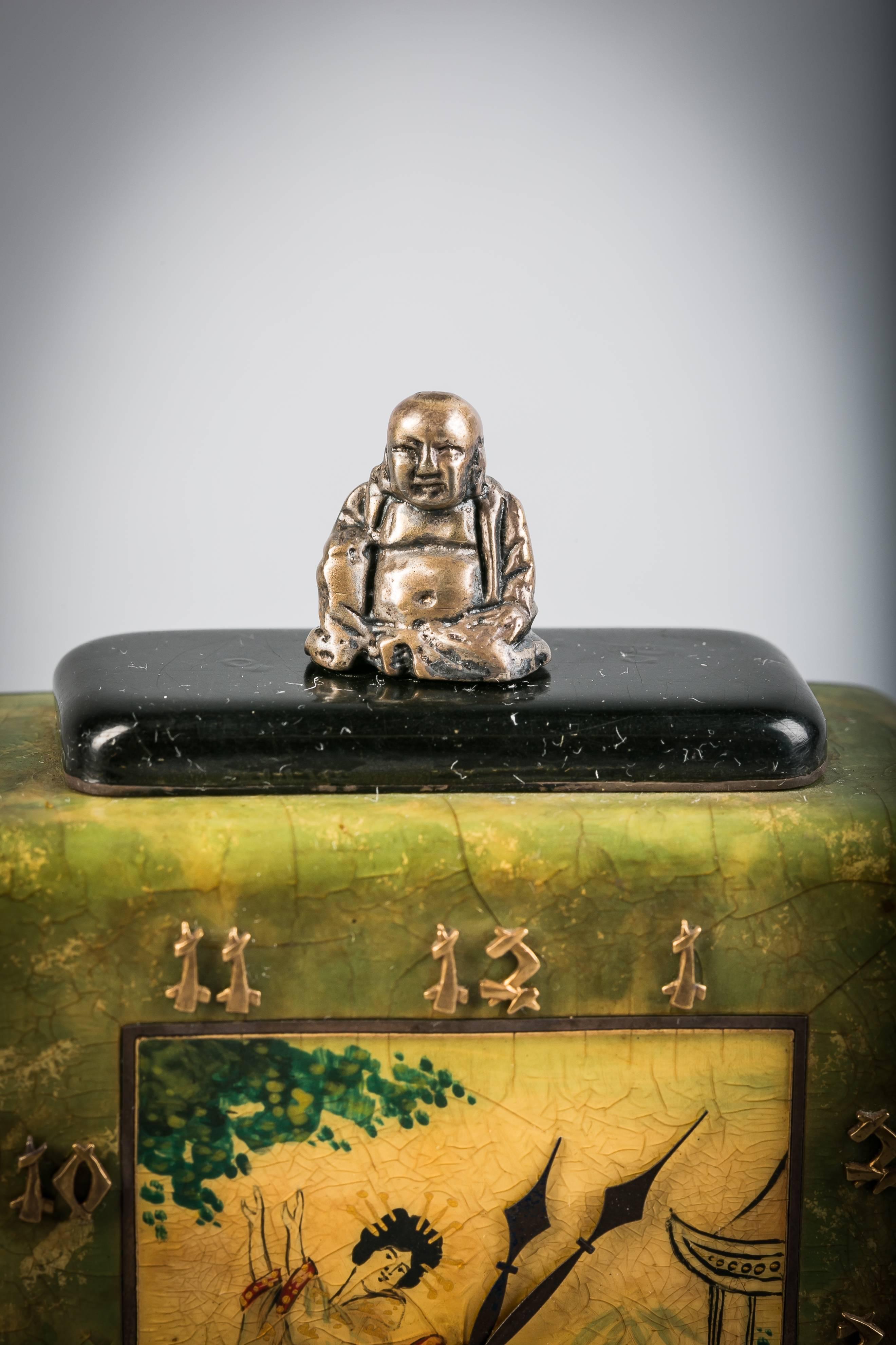 With smoky Agate Buddha all mounted on a silvered bronze and enamel rose quartz base.