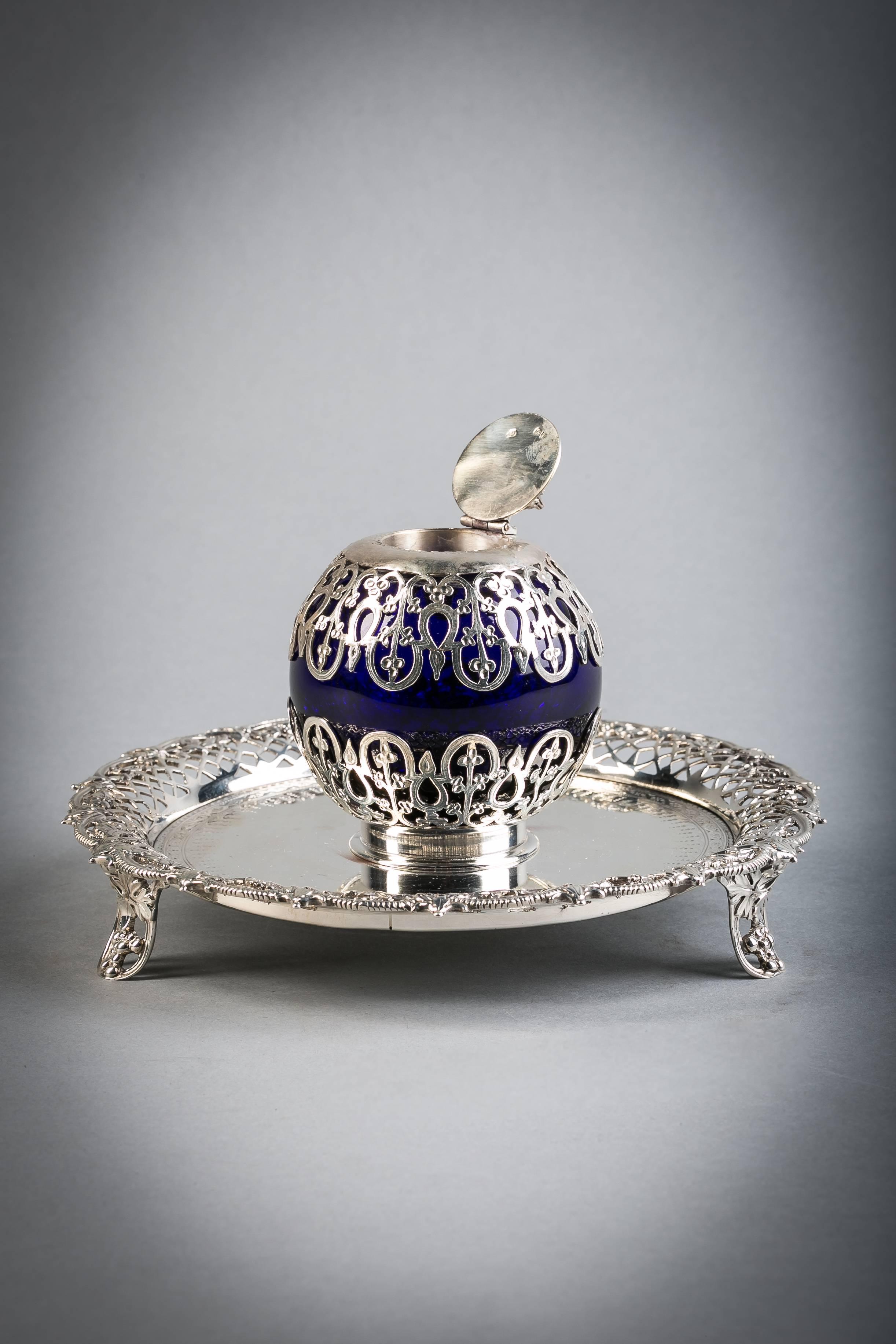 English Victorian silver and blue glass inkwell.

Marked: George Fox, London, 1878.