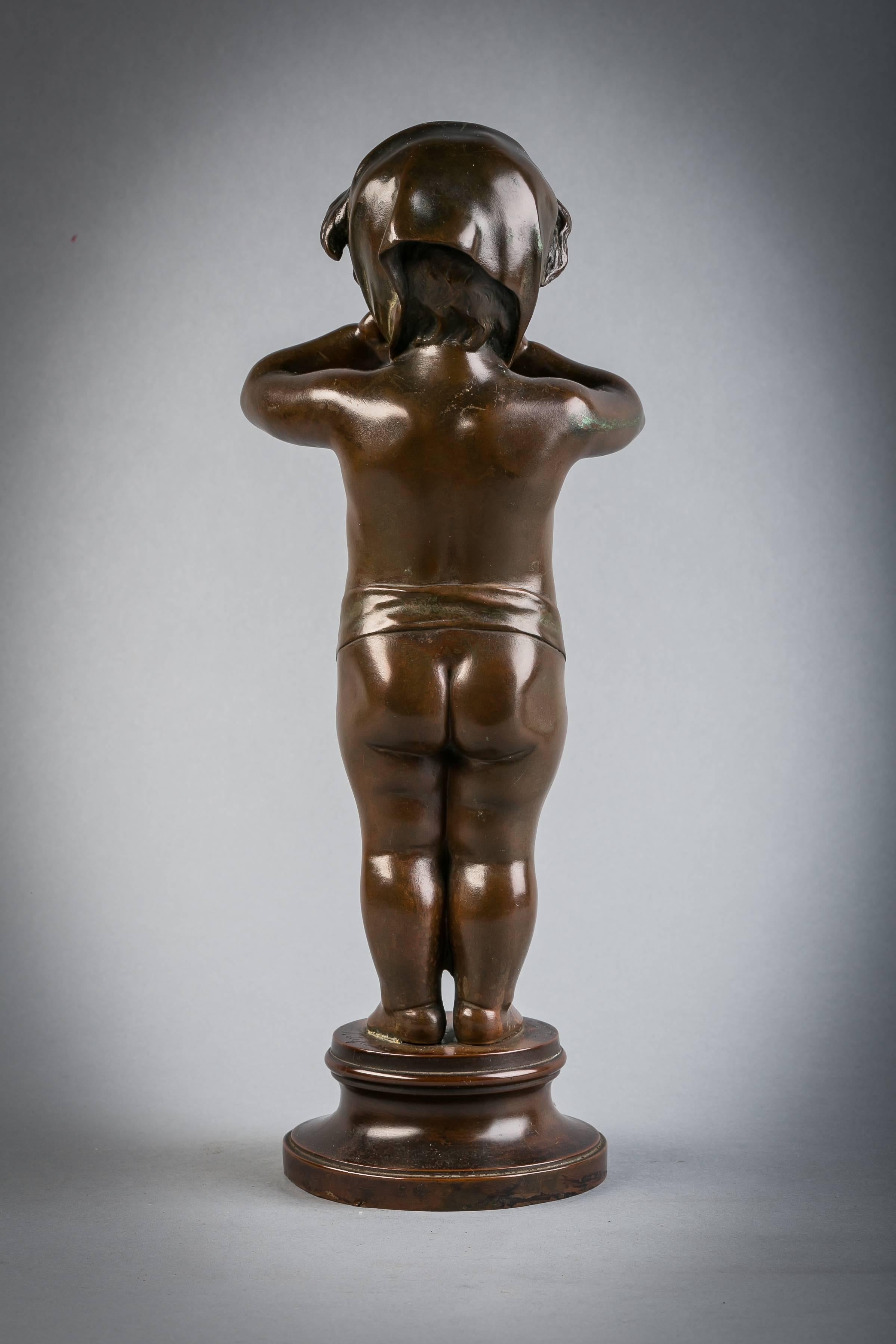 Escultura de bronce de un niño soplando un beso, firmada A. Lefebvre, titulada 