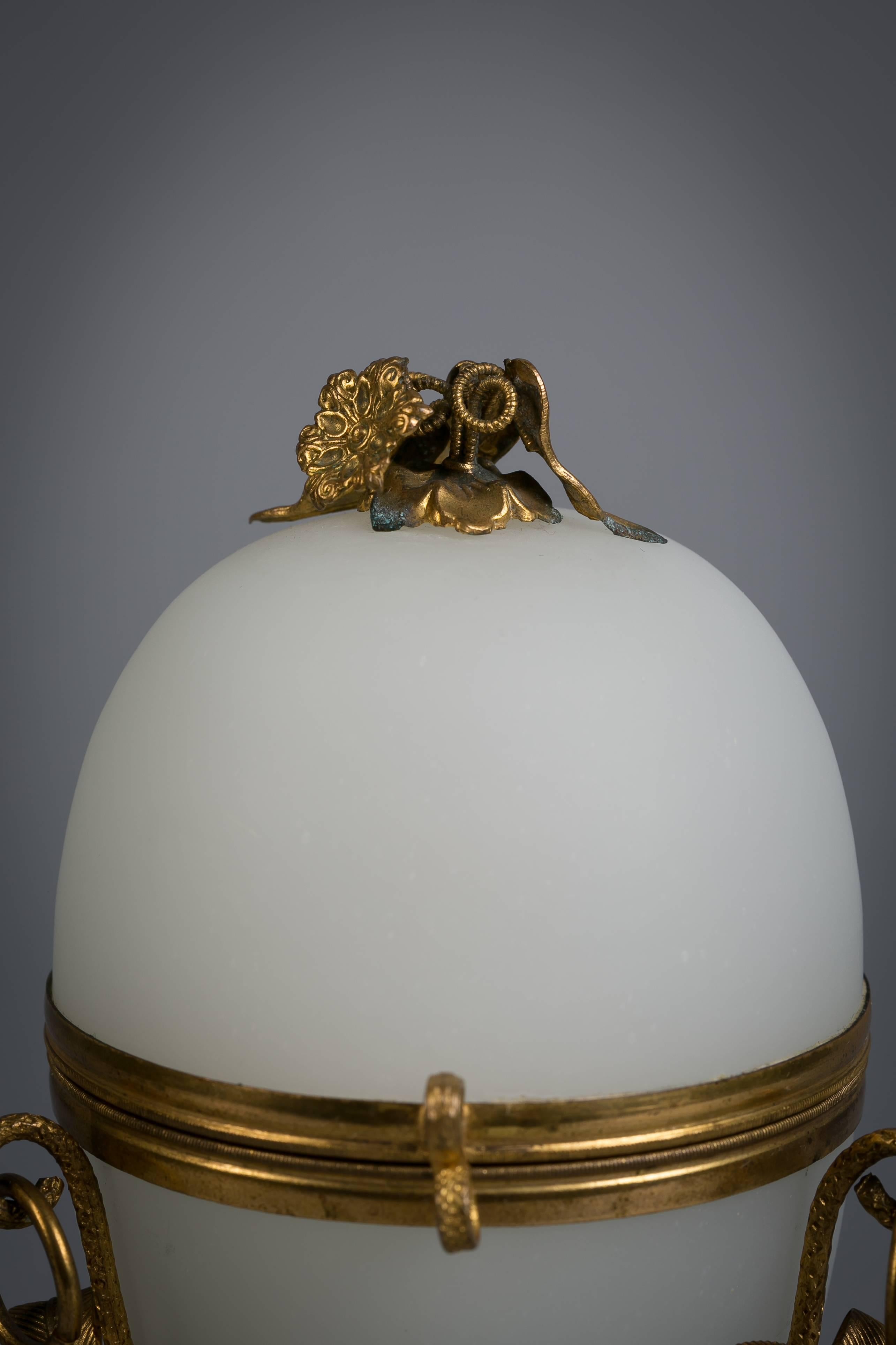 French opaline glass egg shaped container with perfume bottle and gilt metal mounts, circa 1890.