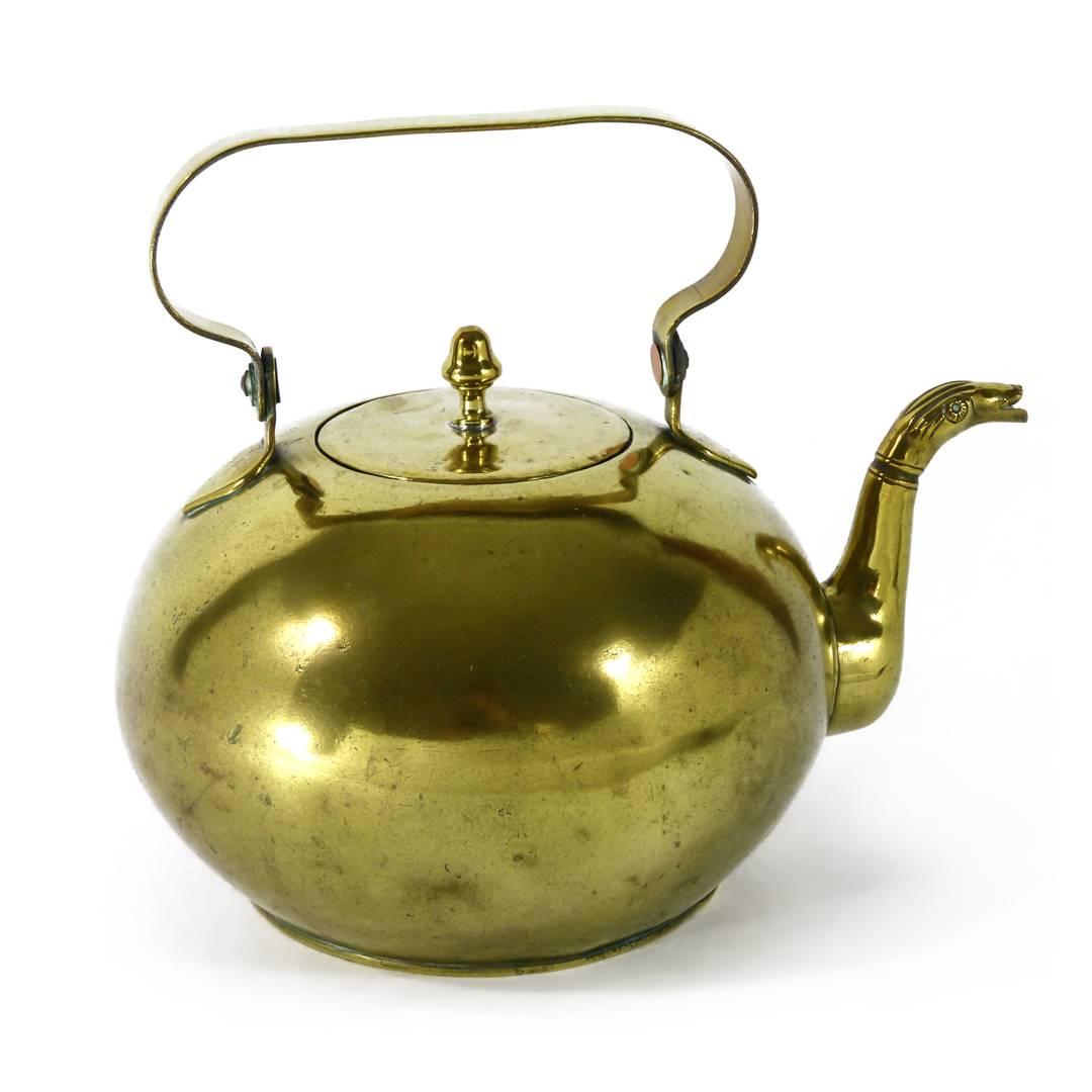 Unusual Dutch brass kettle with serpent spout. Swing handle. Acorn finial, circa 1800. Measures: Height 8″, DOB 4 7/8″.