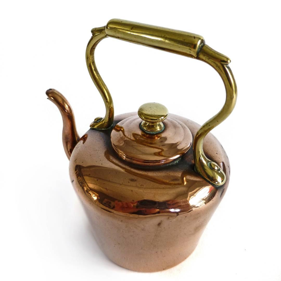 English Victorian miniature copper kettle, circa 1875.
Brass handle and brass mushroom finial.
Measures: 3 7/8” wide 3 3/4” tall dob 2 1/4”.