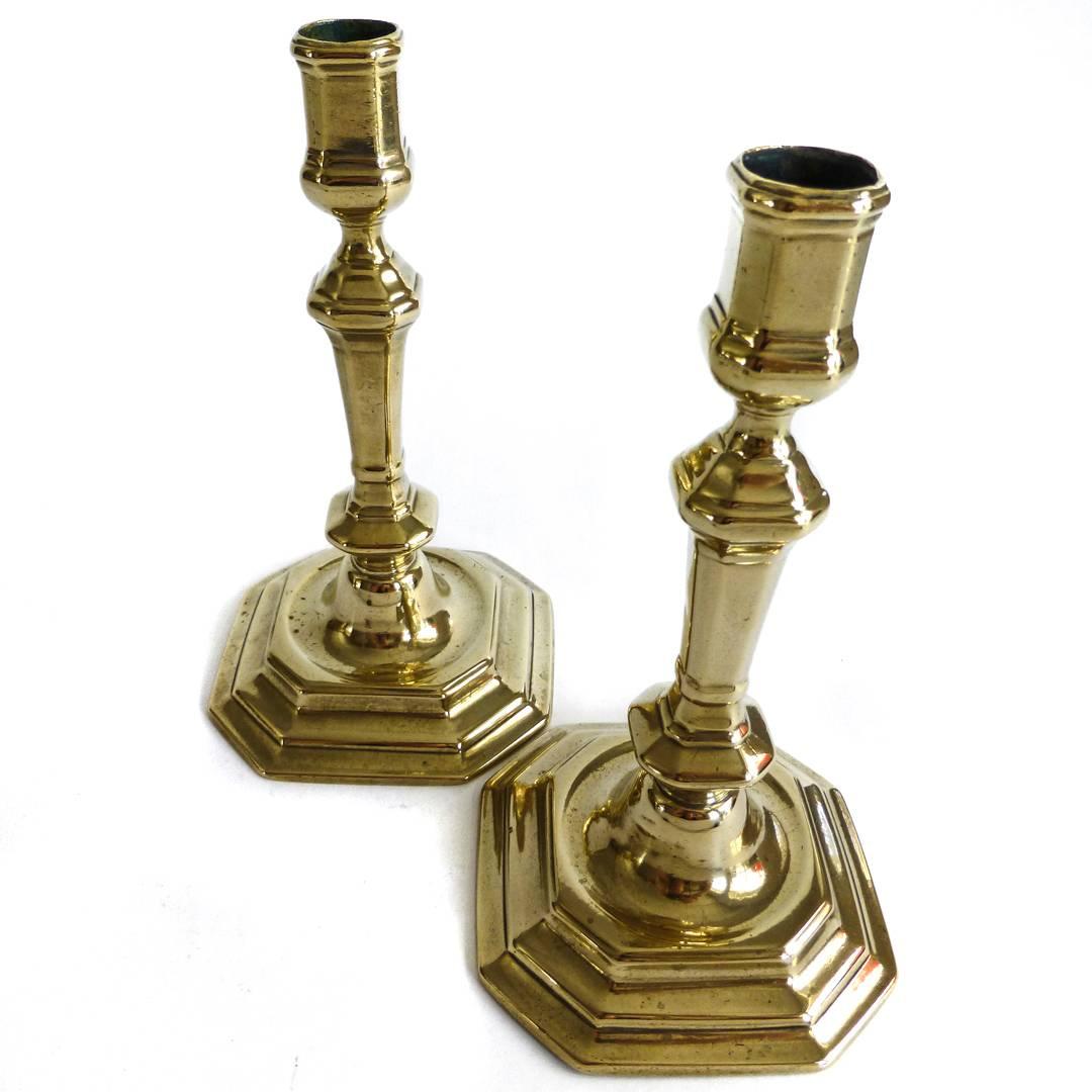 Pair of French silver form 18th century brass candlesticks. Seamed. Tooled bases. Nice size. Great condition, circa 1740. Measures: Height 8 3/8”, base 4 3/4”.