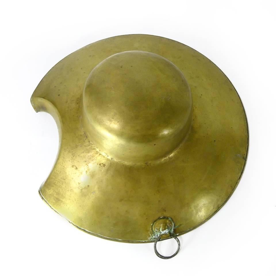 Dutch brass barbers basin. Hand rolled rivet, circa 1780. Hammered out of one-piece of brass over an iron rod for rigidity.

Diameter: 13 3/8″.
Height: 4 1/4″.