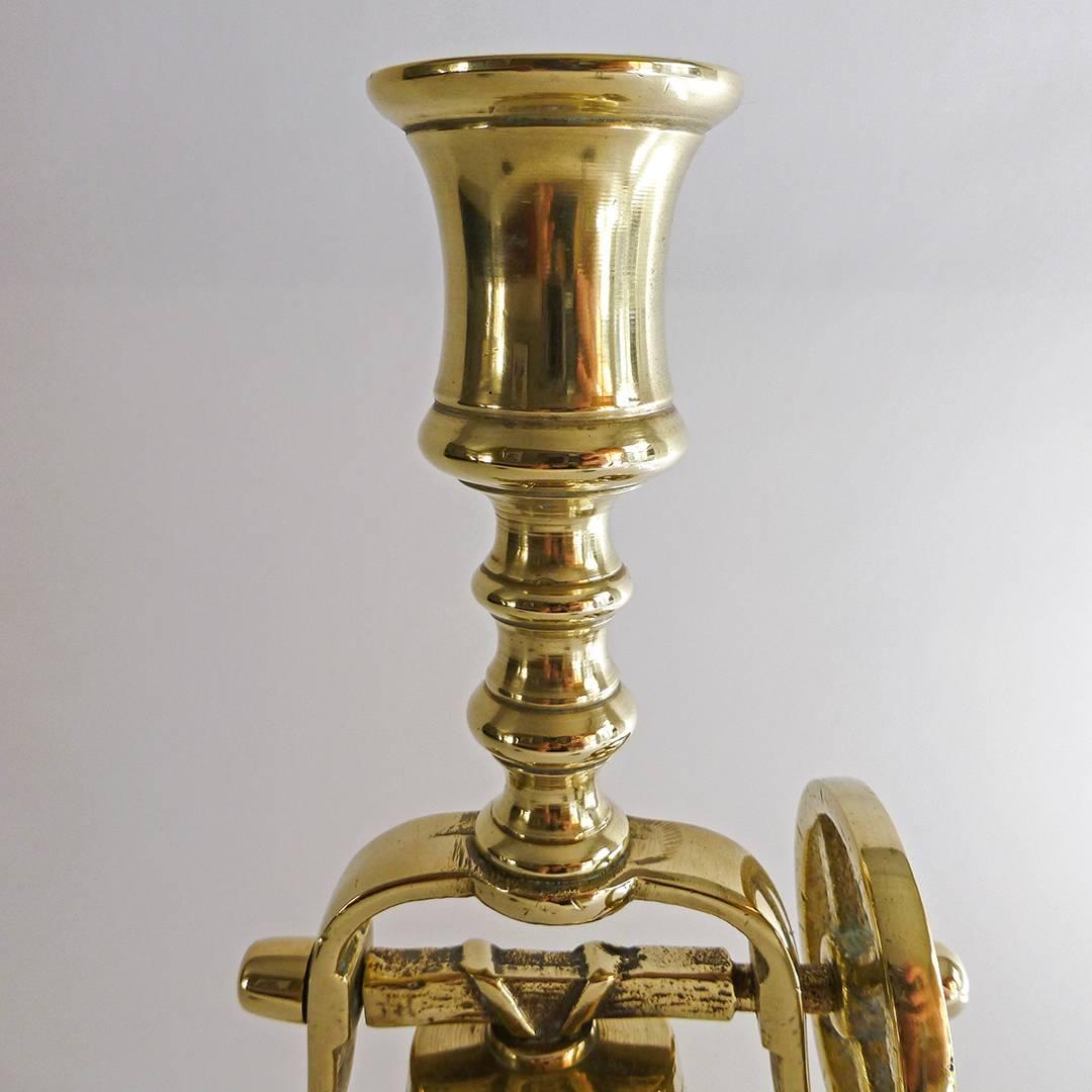 English brass tavern stick with bell and chain, circa 1890.

Fine original condition.

Measures: Height: 11 7/8″.
Diameter of base: 5 3/4″.