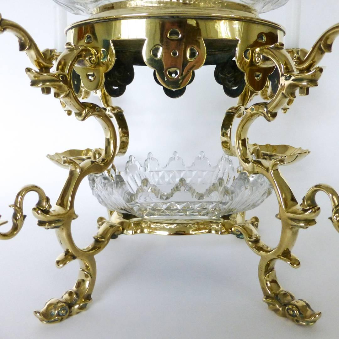 18th century German ‘nuremberg’ silver form brass epergne, circa 1730. Four-arms and four-shell dishes. All Original. Measures: Height with arms: 8 1/2”, width with arms: 17”, depth with arms: 15″.