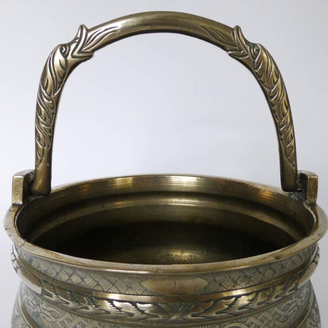 16th century, Italian (Venetian) bronze bucket 'Situla' with swing handle, circa 1525. Two fish on swing handle. Remarkable engraving. Similar example in the Victoria & Albert Museum, London. Measures: Diameter: 8 1/8”, height: 4 1/4” Height with