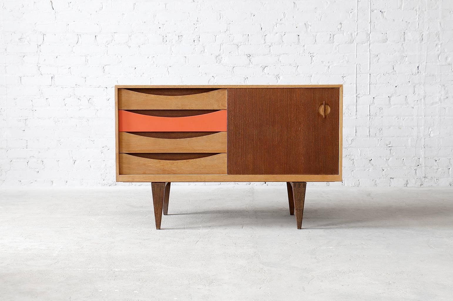 Unique and rarely seen oak and wenge sideboard designed by Erik Wørts for Kjellerup Møbelfabrik. This sideboard features solid wenge legs as well as salmon colored painted drawer and interior.

- Unique oak and wenge construction
- Excellent
