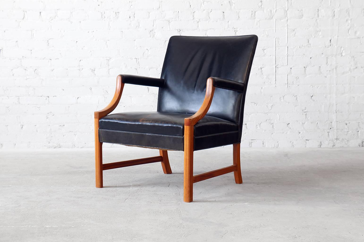 Attractive and elegant vintage easy chair designed by Ole Wanscher for A.J. Iversen. This chair was based on an English Gainsborough chair and features solid mahogany frame as well as nice patina to the original leather upholstery.

- Designed