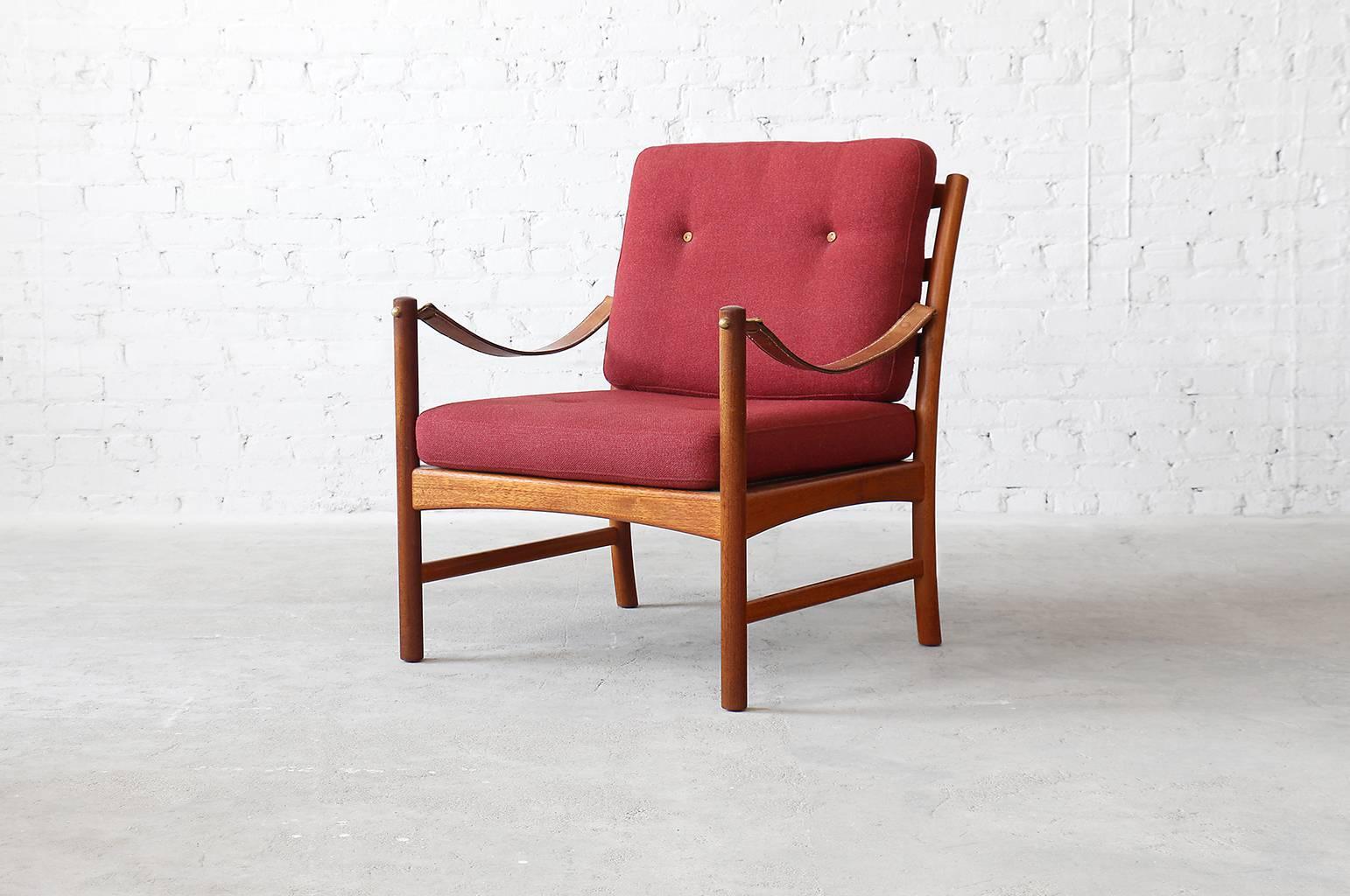 Rarely seen vintage easy chairs designed by Ejner Larsen & Aksel Bender-Madsen for Willy Beck. Executed in solid mahogany with leather armrests as seen on safari style chairs and red Danish wool. Purchased directly from Willy Beck in 1971 by