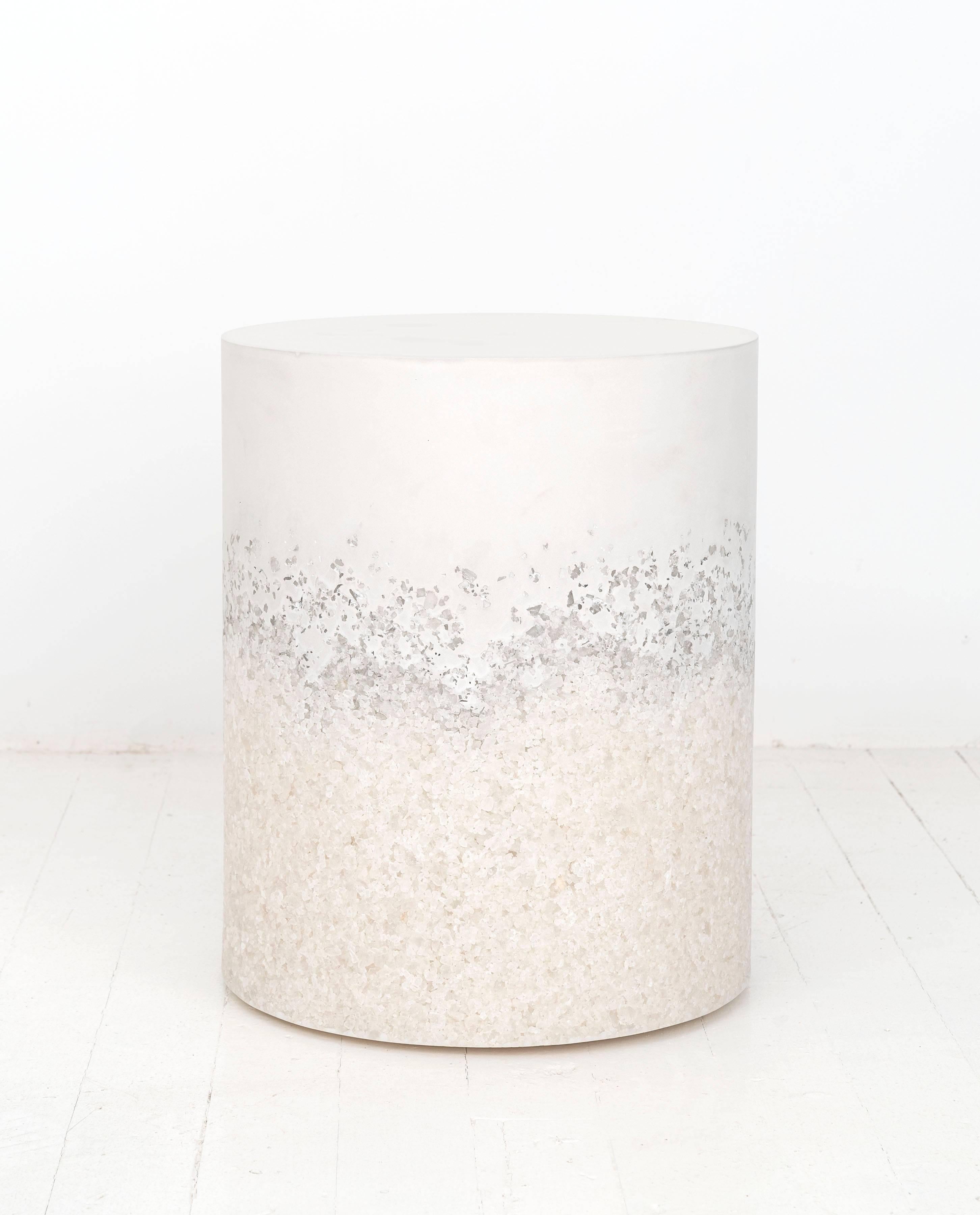 This made-to-order drum consists of a hand-dyed white cement top and a packed white rock salt bottom. The cement is poured by hand over the salt, creating an organic blend of the materials. The piece has a hollow cavity and weighs approximately